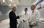 CORRECTS LAST NAME FROM LIVINE TO LEVINE- Vice President Joe Biden, left, gestures while speaking with Dr. Bruce L. Levine PH.D., center, and Dr. Carl
