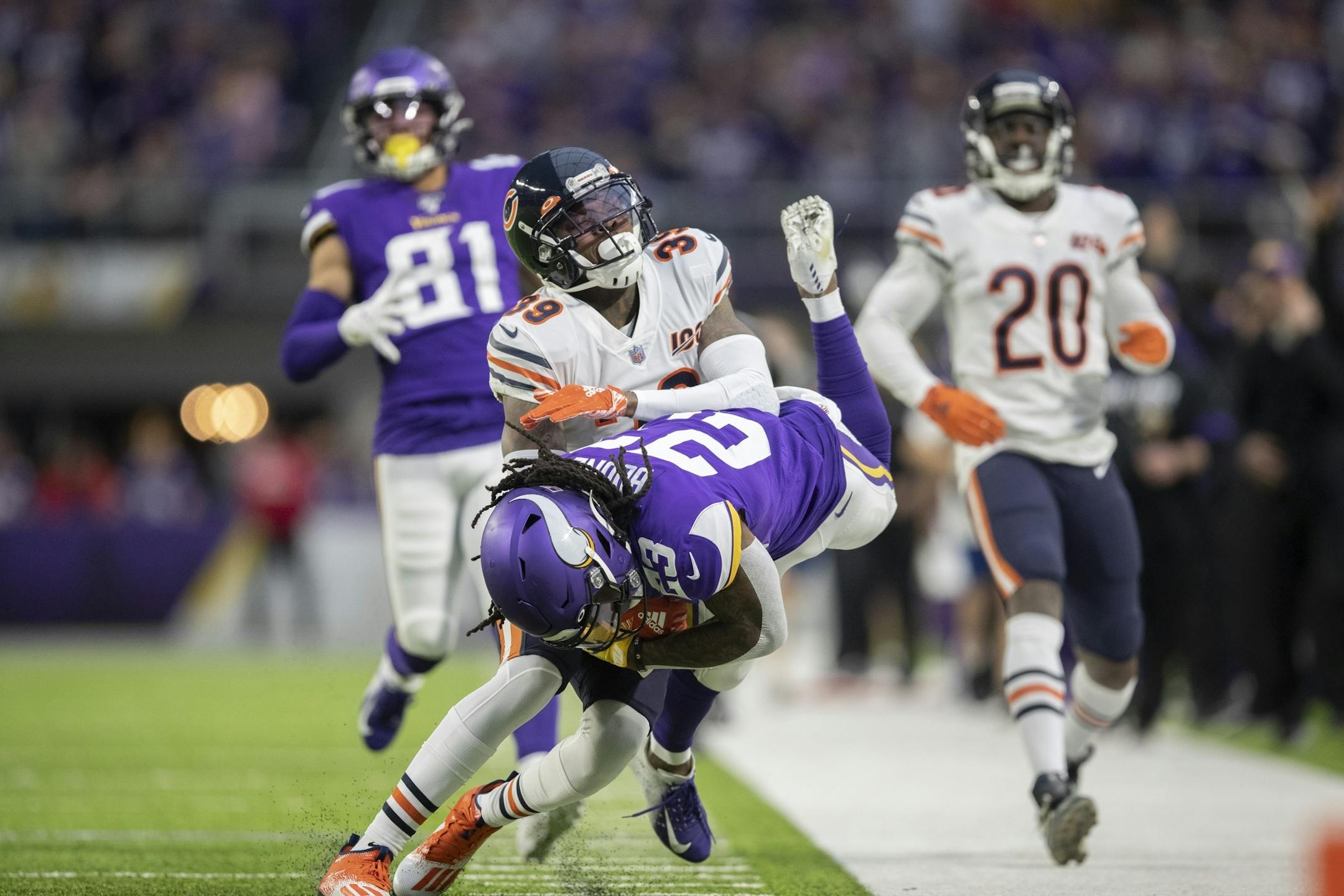 Minnesota Vikings running back Mike Boone (23) picked 60 yards on first quarter run, and was tackled by Chicago Bears free safety Eddie Jackson (39).