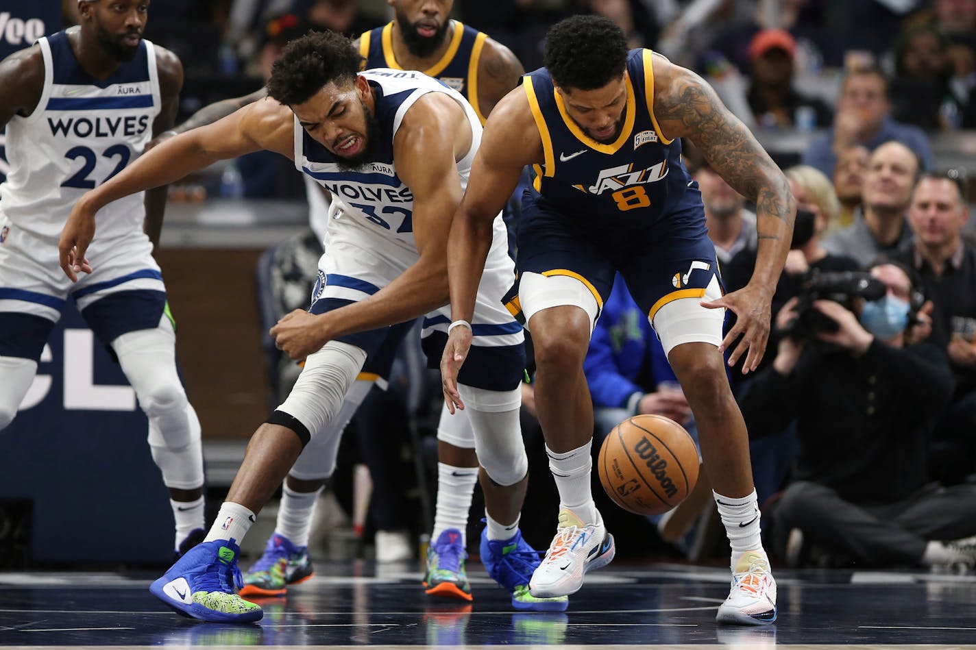 Utah forward Rudy Gay and Timberwolves center Karl-Anthony Towns scramble for the loose ball during the second half.