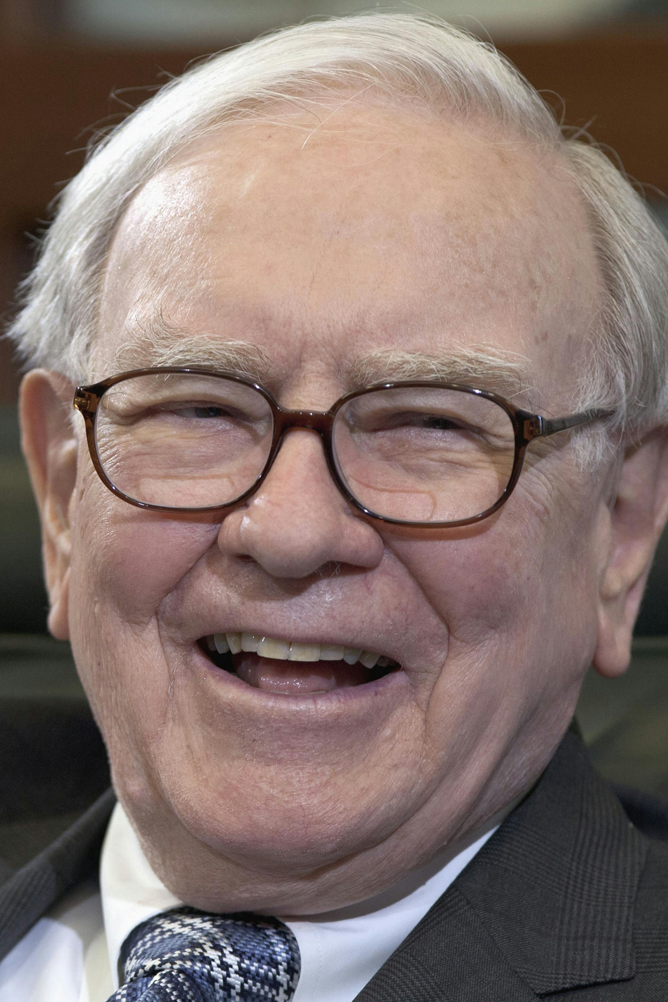 FILE - In this May 7, 2012, file photo Warren Buffett, chairman and CEO of Berkshire Hathaway, laughs during an interview in Omaha, Neb. Omaha wonít throw a bash for Buffettís 82nd birthday on Thursday, Aug. 30, 2012, but his hometown is grateful the billionaire never considered leaving Omaha behind because he has bolstered the cityís reputation and attracted thousands of tourists. (AP Photo/Nati Harnik, File) ORG XMIT: MIN2012091716105994