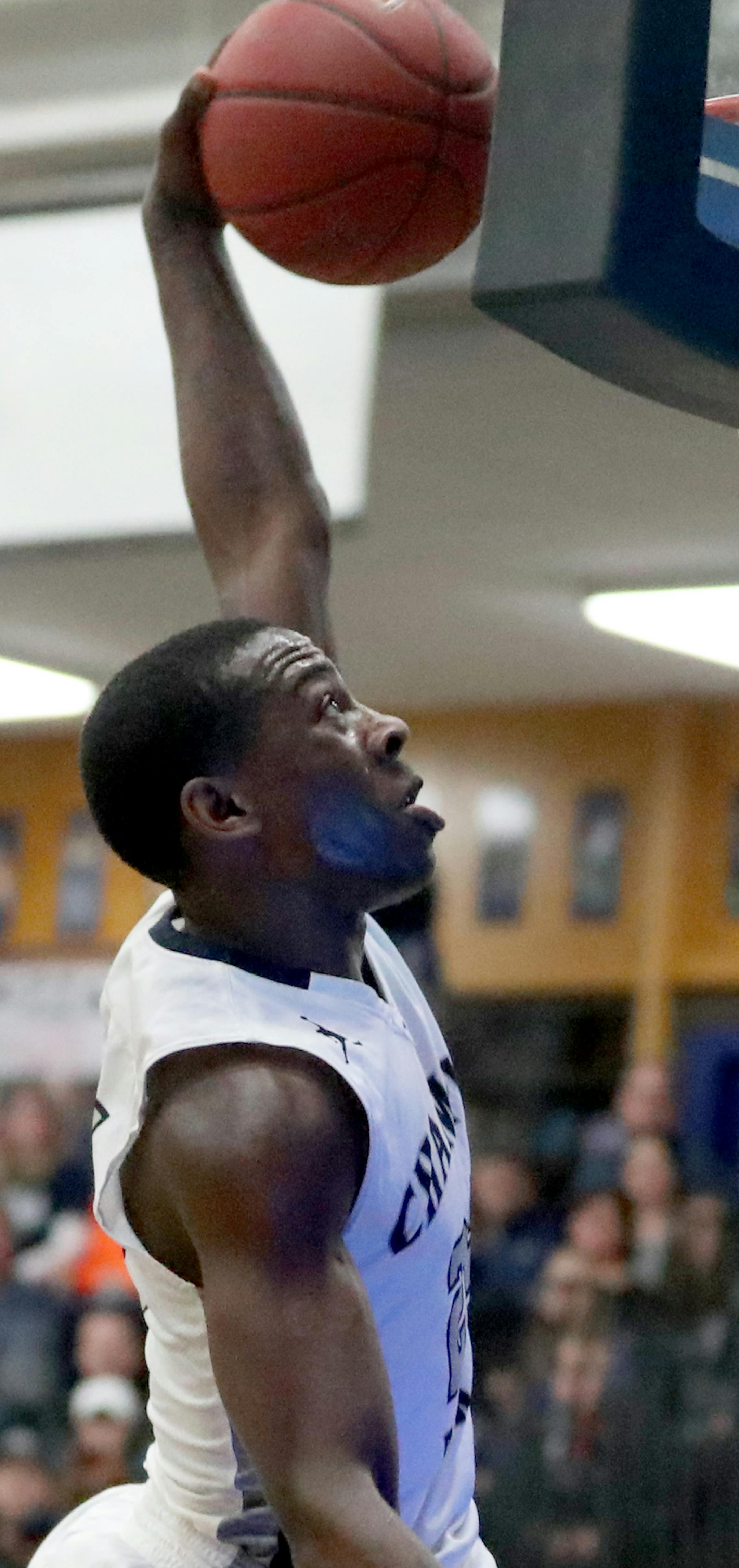 Champlin Park's McKinley Wright IV throws down a left-handed break away dunk during the first half at Blaine High Friday, Jan. 20, 2017, in Blaine, MN.](DAVID JOLES STARTRIBUNE)djoles@startribune.com Boys' basketball, Champlin Park at Blaine