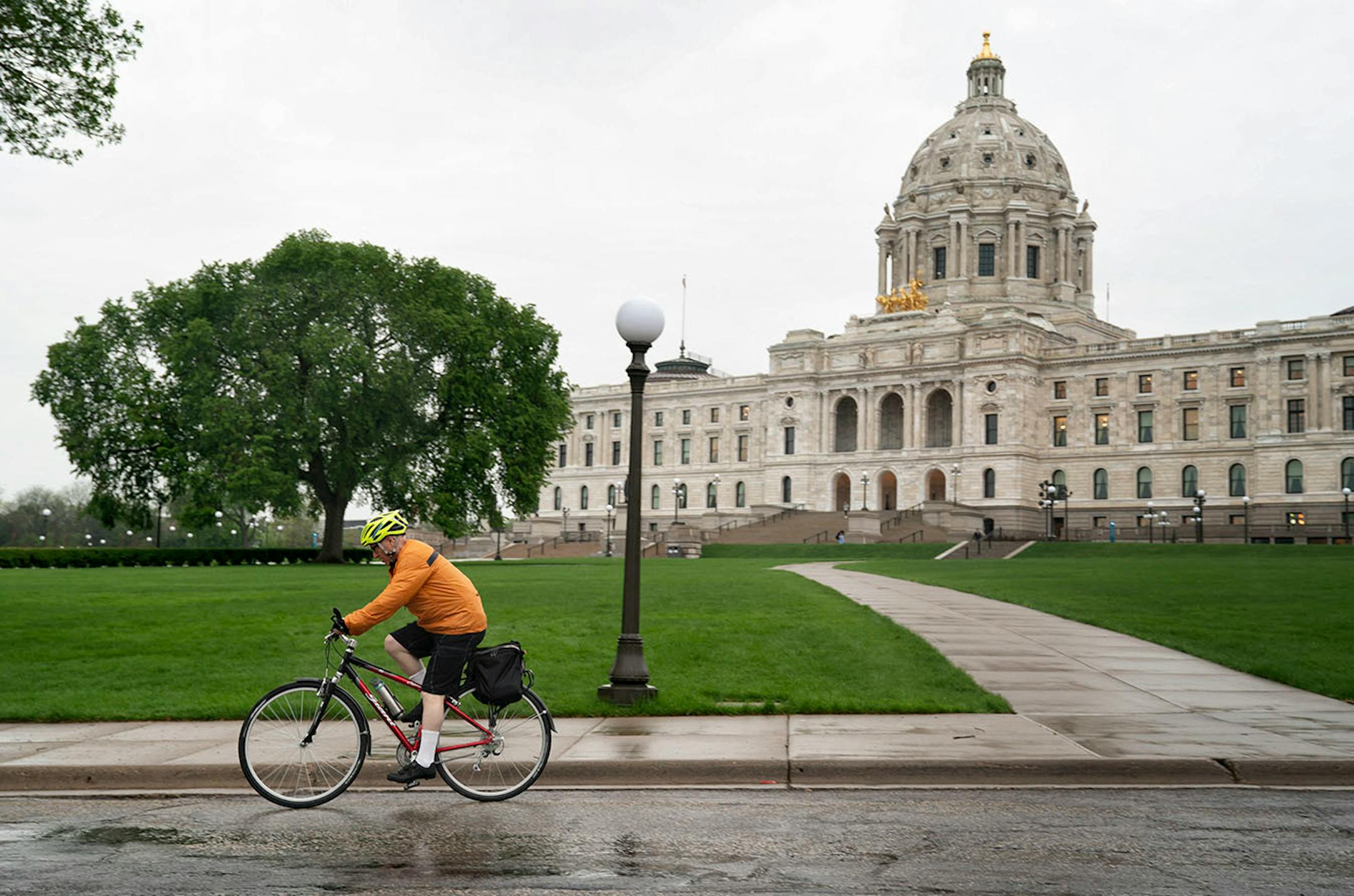 Commissioner Frans changed from his suit into a rain jacket and shorts for the 13-mile bicycle ride home to Minneapolis.