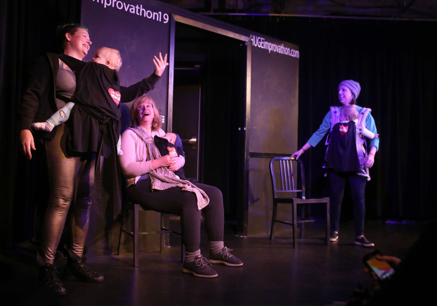 As part of Give to the Max Day, HUGE Improv Theater in Minneapolis hosted Huge Improvathon 2019 -- 28 continous hours of improv starting Wednesday and seen Thursday, Nov. 14, 2019, in Minneapolis, MN. Here, improvisers with Resist Sleep, including Shea Roberts, left to right, Molly Chase and Becky Hauser and their children, during their 20 minute improv.