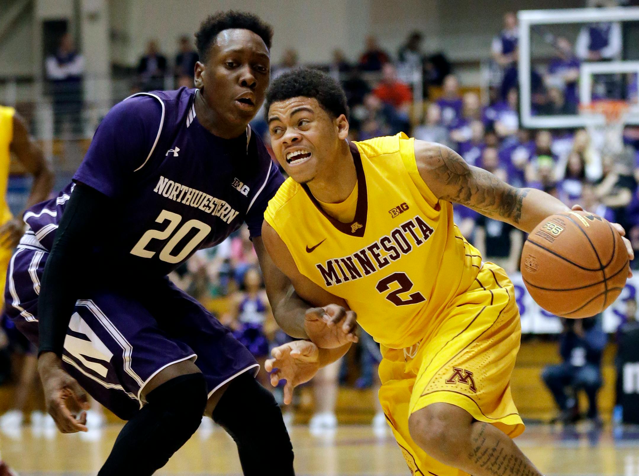 Minnesota guard Nate Mason, right, drives against Northwestern guard/forward Scottie Lindsey during the first half of an NCAA college basketball game on Thursday, Feb. 4, 2016, in Evanston, Ill. (AP Photo/Nam Y. Huh)