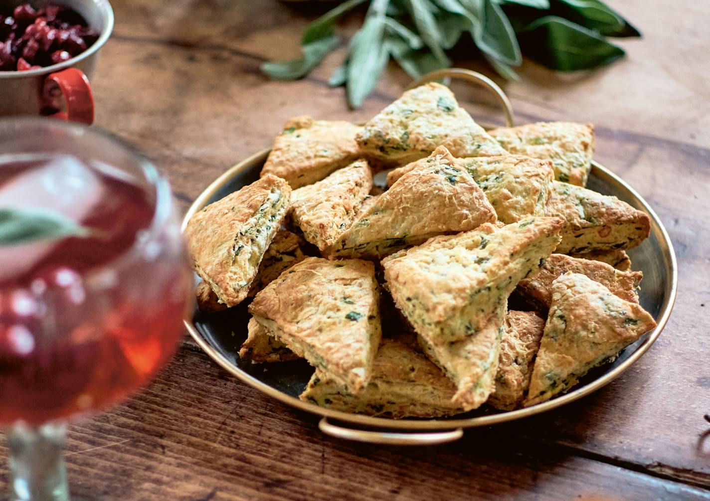 Mini Cheddar, Spinach and Caramelized Onion Scones from "My Art of Entertaining: Recipes and Tips from Miss Maggie's Kitchen," by Héloïse Broin (Flammarion, 2022).©ChristopheRoue