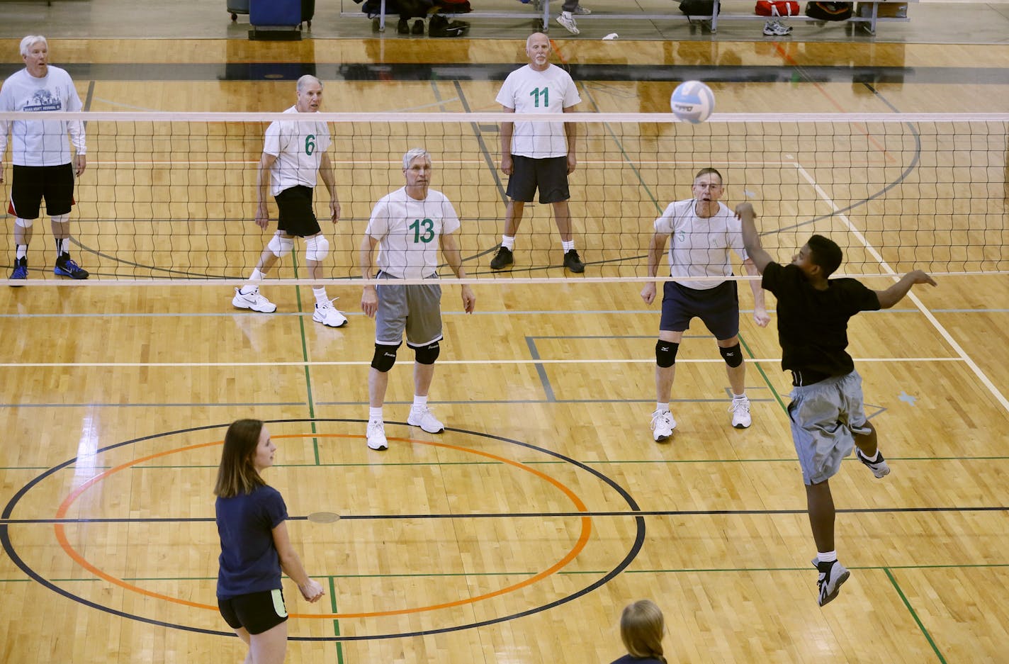 A group of senior citizens who call themselves "Born Again Jocks" played volleyball with sophomore students at Kennedy High school Monday March 2, 2015 in Bloomington, Minnesota. The team includes seniors who have been selected to play in the upcoming Senior Olympics this summer.] Jerry Holt/ Jerry.Holt@Startribune.com