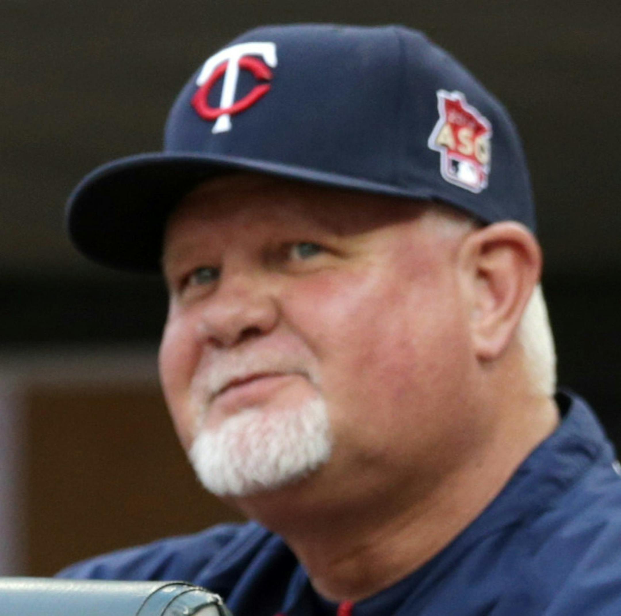 Minnesota Twins manager Ron Gardenhire smiles after an out call on a third base steal attempt by Brian Dozier was reversed on review and Dozier was safe in the first inning of a baseball game against the Milwaukee Brewers, Wednesday, June 4, 2014, in Minneapolis. (AP Photo/Jim Mone)