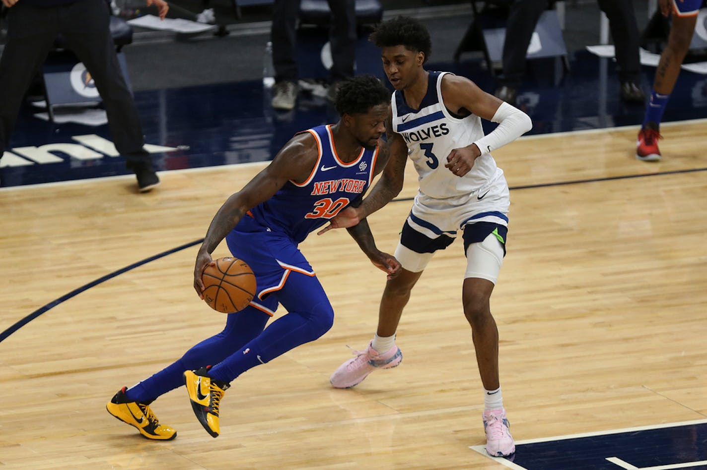 New York Knicks' Julius Randle (30) drives the ball around Minnesota Timberwolves' Jaden McDaniels (3) on Wednesday.