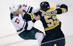 Boston Bruins center Noel Acciari (55) lines up a punch in his fight against Minnesota Wild center Zac Dalpe (27) during the first period of an NHL ho