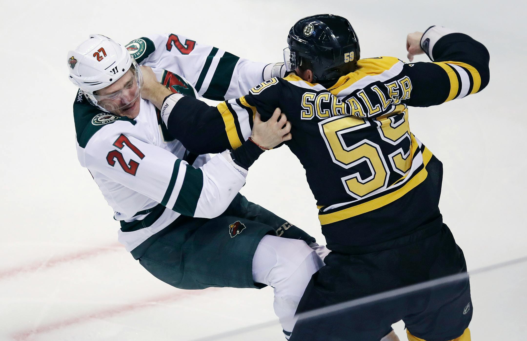 Boston Bruins center Noel Acciari (55) lines up a punch in his fight against Minnesota Wild center Zac Dalpe (27) during the first period of an NHL hockey game in Boston, Tuesday, Oct. 25, 2016. (AP Photo/Charles Krupa)