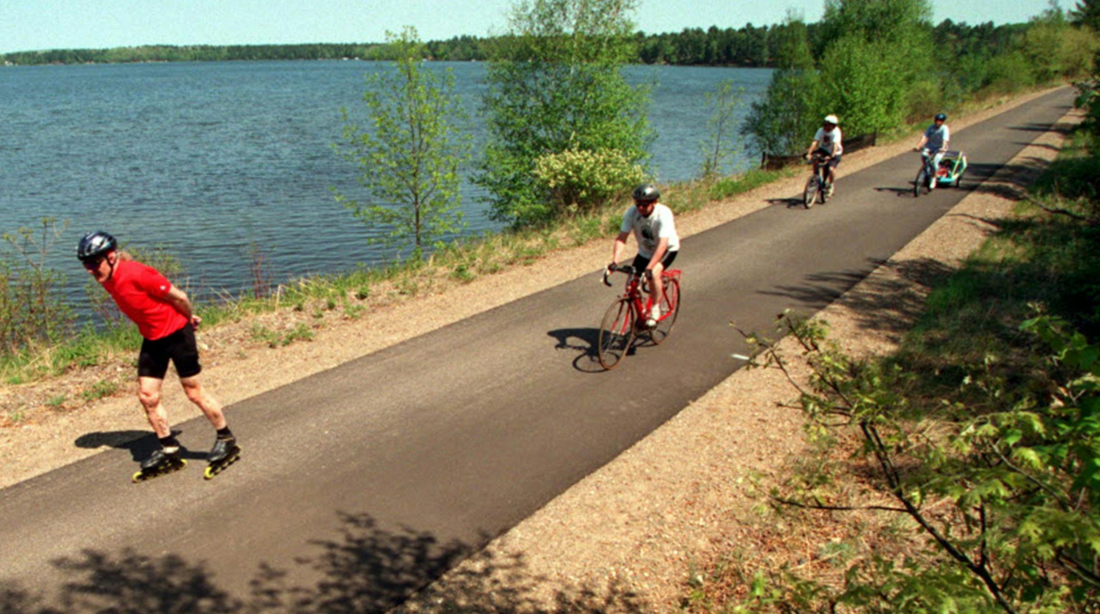 IN-LINE SKATERS AND BIKERS SHARE THE PAUL BUNYAN TRAIL NEXT TO LOWER CULLEN LAKE. ORG XMIT: MIN2014072415502061