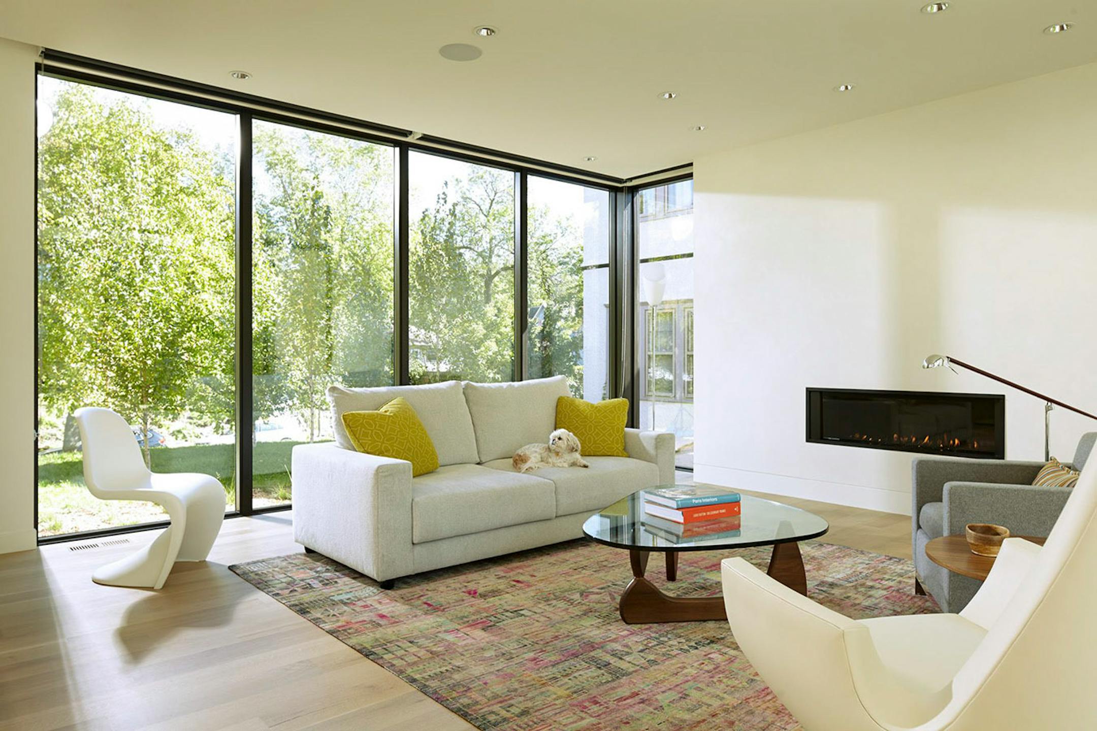 The floor to ceiling glass in the living room faces the street.