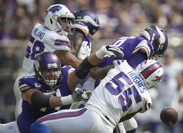 Buffalo Bills defensive end Jerry Hughes (55) sacked Minnesota Vikings quarterback Kirk Cousins (8) for a fumble recovered by the Bills in the first q