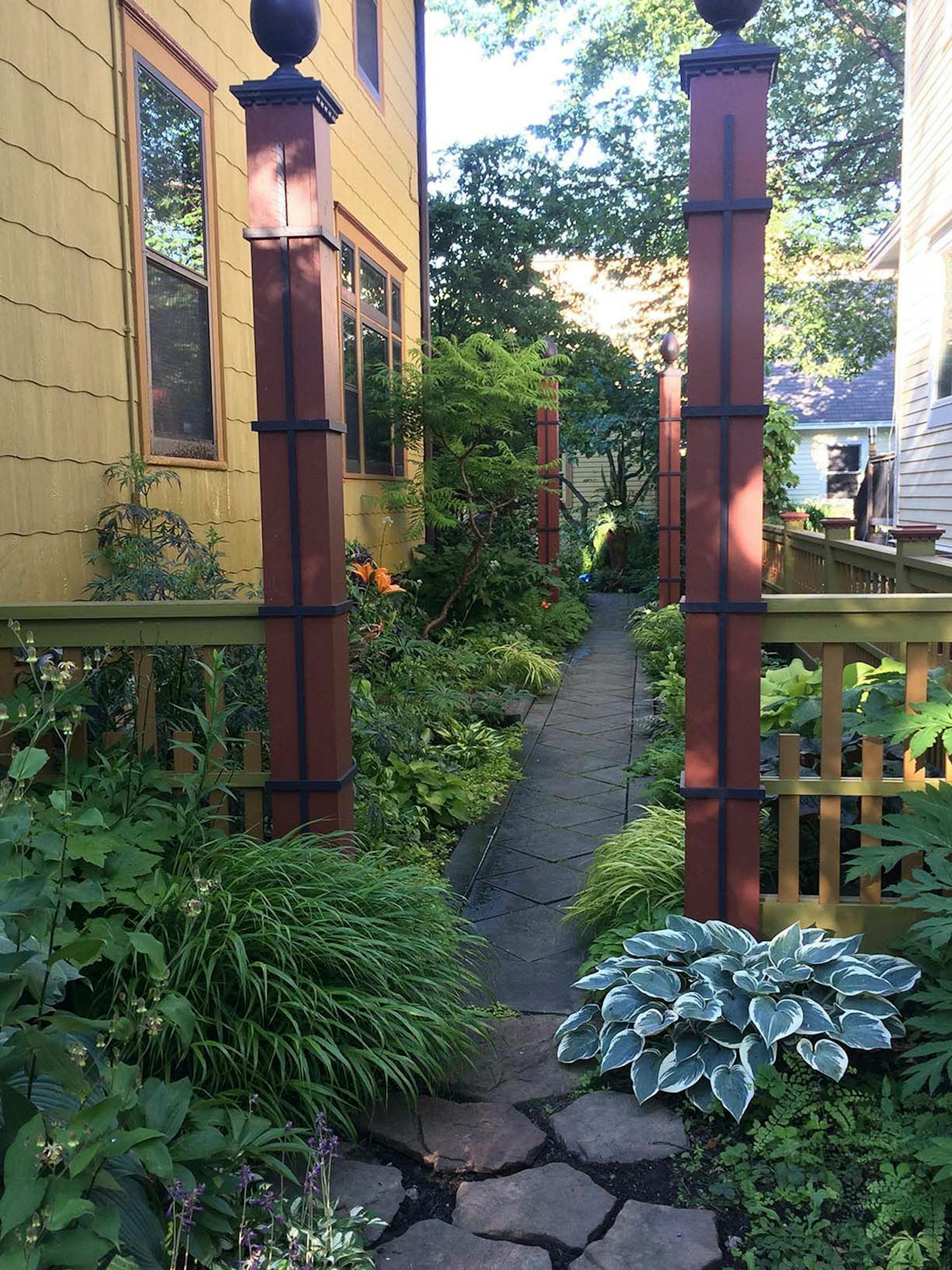 The side yard and path to Fitzgerald's backyard.