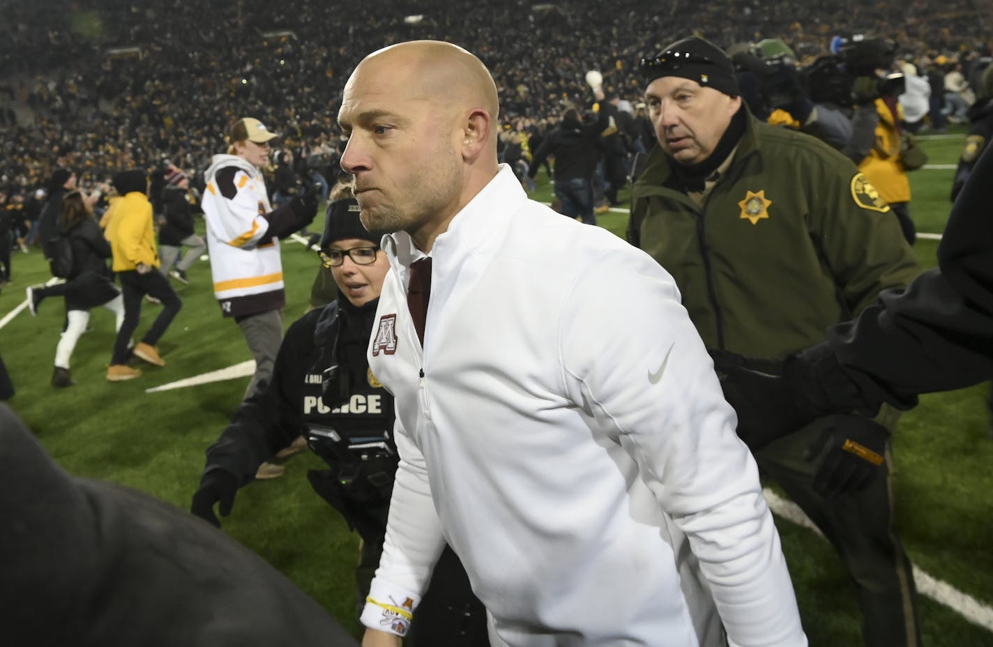 Minnesota Gophers head coach P.J. Fleck was escorted off the field by law enforcement following his team's 23-19 loss to the Iowa Hawkeyes. ] Aaron Lavinsky &#x2022; aaron.lavinsky@startribune.com The Minnesota Gophers played the Iowa Hawkeyes on Saturday, Nov. 16, 2019 at Kinnick Stadium in Iowa City, IA.