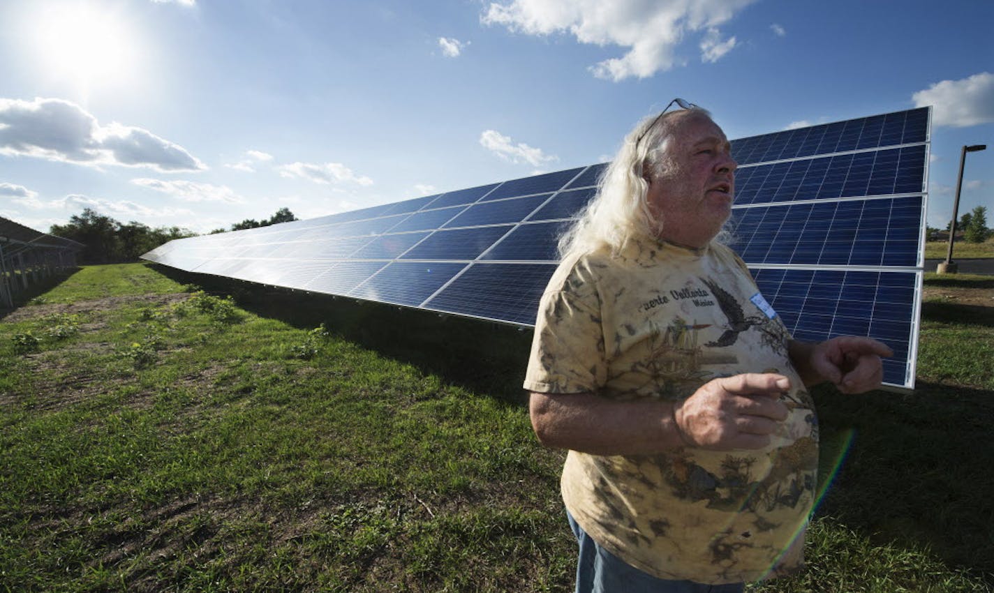 Dave Willard talks about his purchase of a solor panel at the Connexus Energy community solar array. ] Connexus Energy just completed its first community solar array, in which members of the electric co-op purchase shares of its output to offset their electric bills. The coop is having a meeting tonight to talk to subscribers and potential new subscribers and will give a tour of array. 853355 Solar 20035794A (DAVID BREWSTER/STAR TRIBUNE)