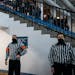 Referees stood for the National Anthem before the St. Michael-Albertville and Benilde-St. Margaret's hockey game. ] LEILA NAVIDI • leila.navidi@star