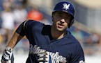 Milwaukee Brewers' Ryan Braun (8) rounds third after hitting a game-tying solo home run off Pittsburgh Pirates closer Jason Grilli during the ninth in