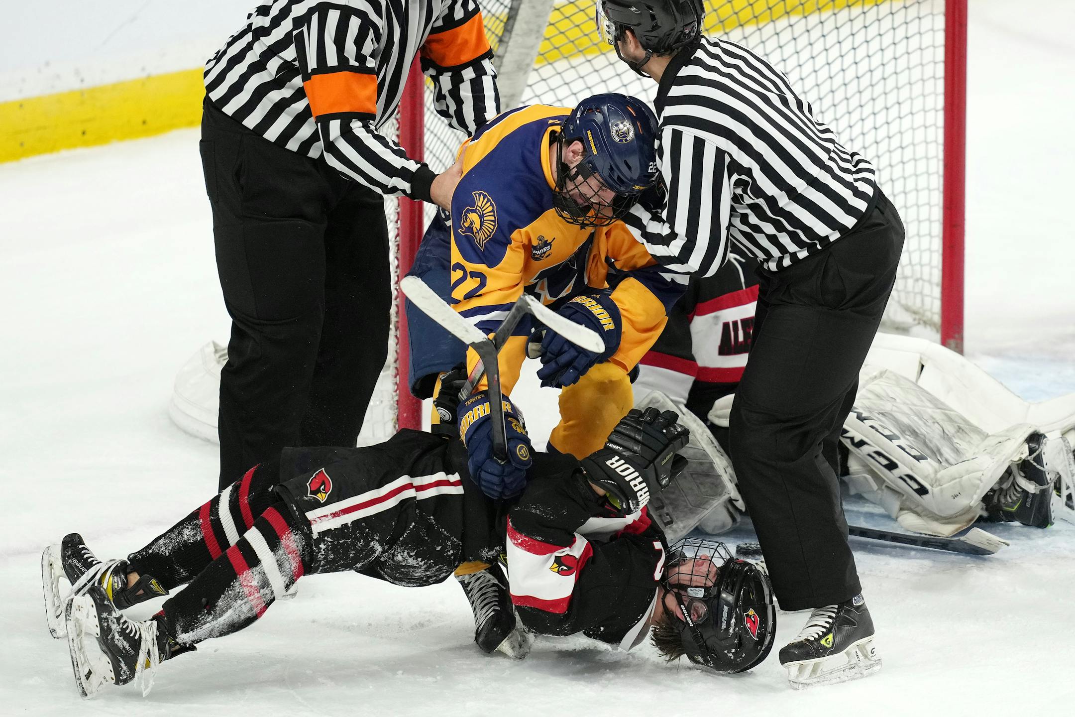 Mahtomedi forward Carter Haycraft (22) tangles with Alexandria defenseman Jack Lamski (2) in the third period of a MSHSL Class 1A quarterfinal hockey game between Alexandria and Mahtomedi.