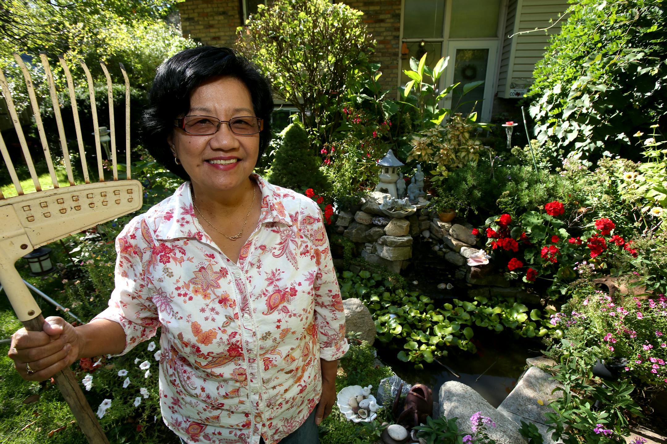 Catherine Navalta Japanese-inspired garden won top honors in New Hope's suburban home awards. Catherine is a born caregiver. She is a registered nurse helping patients recovering from brain injuries and strokes. At home she nurses her spectacular flower garden. She grew up in the Phillipines and remembers the scent of gardenias wafting from her mother's flower garden. New Hope, MN on October 9, 2013. ] JOELKOYAMA‚Ä¢joel koyama@startribune
