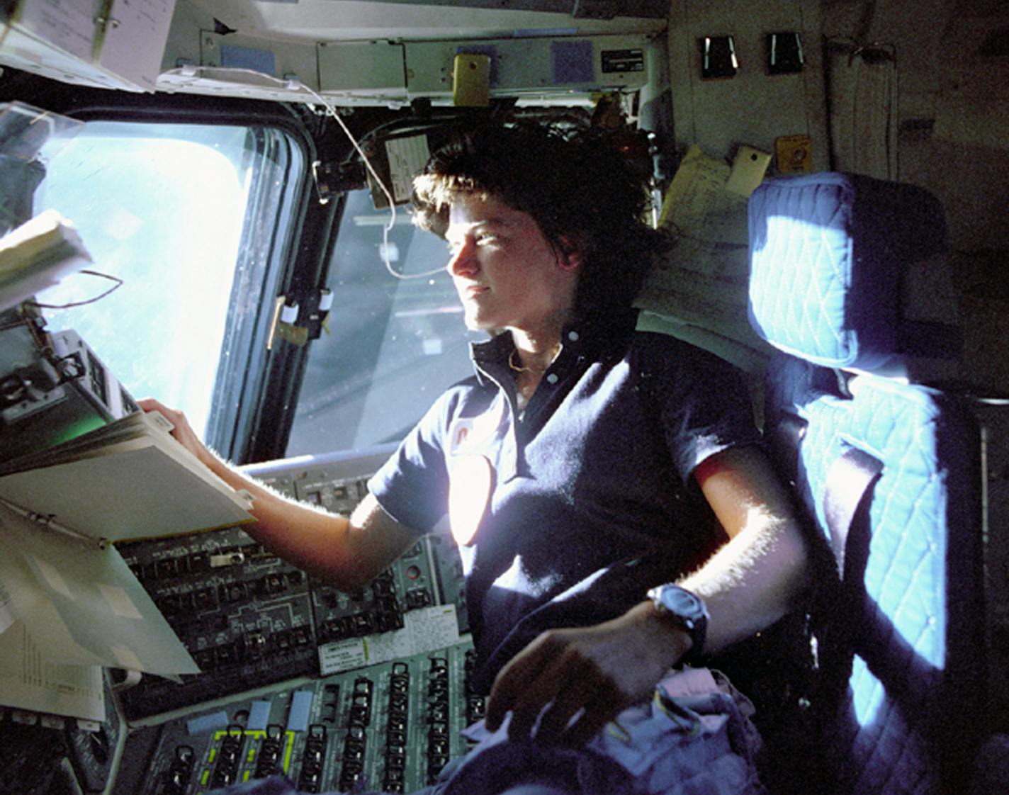 FILE - In this June 1983 photo provided by NASA, astronaut Sally Ride, a specialist on shuttle mission STS-7, monitors control panels from the pilot's chair on the shuttle Columbia flight deck. Ride became America's first woman in space when Columbia launched June 18, 1983. (AP Photo/NASA/File)