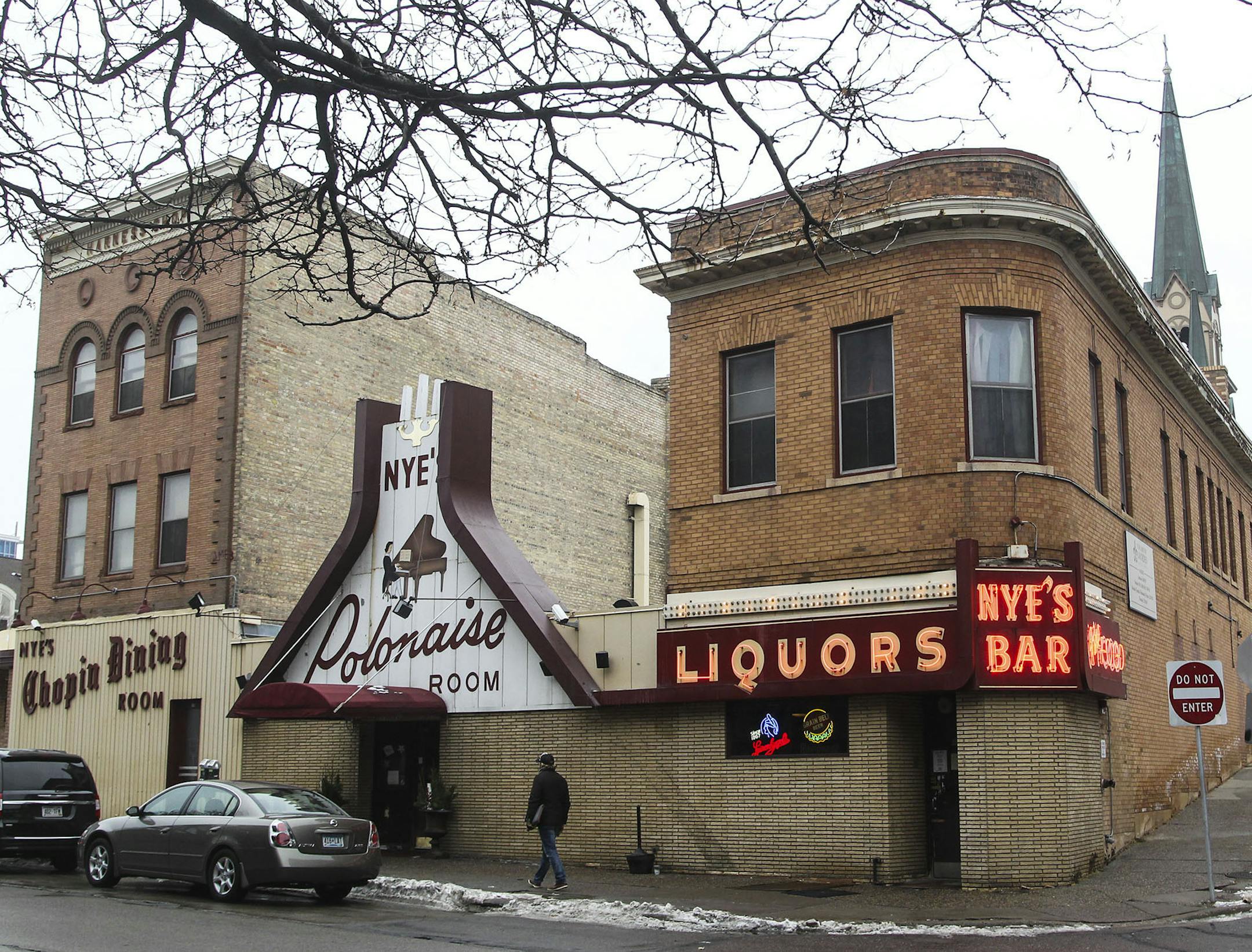 A three-story building to the left of the iconic Nye's Polonaise front door was built as a harness shop in 1907 was seen Friday, DEc. 5, 2014, in Minneapolis, MN.](DAVID JOLES/STARTRIBUNE)djoles@startribune.com The owner of Nye's Polonaise may intend to close the Minneapolis institution next year, but demolishing the buildings wil be a tough sell at City Hall. Two of the four buildings on the site are contributing to the St. Anthony Falls Historic District, which gives them major protections und