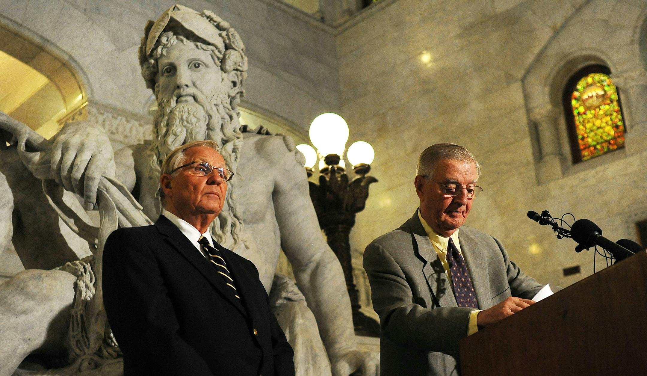 Former Minnesota Gov. Arne Carlson, left, and former Vice President Walter Mondale listen to questions during a news conference on Tuesday, July 5, 2011 in Minneapolis. Mondale and Carlson announced an independent commission designed to resolve Minnesota's budget deadlock. Carlson and Mondale won't serve on the panel. They say it will be co-chaired by Republican former state Sen. Stephen Dille and Democratic former state Rep. Wayne Simoneau. The commission will also include Gov. Mark Dayton's bu