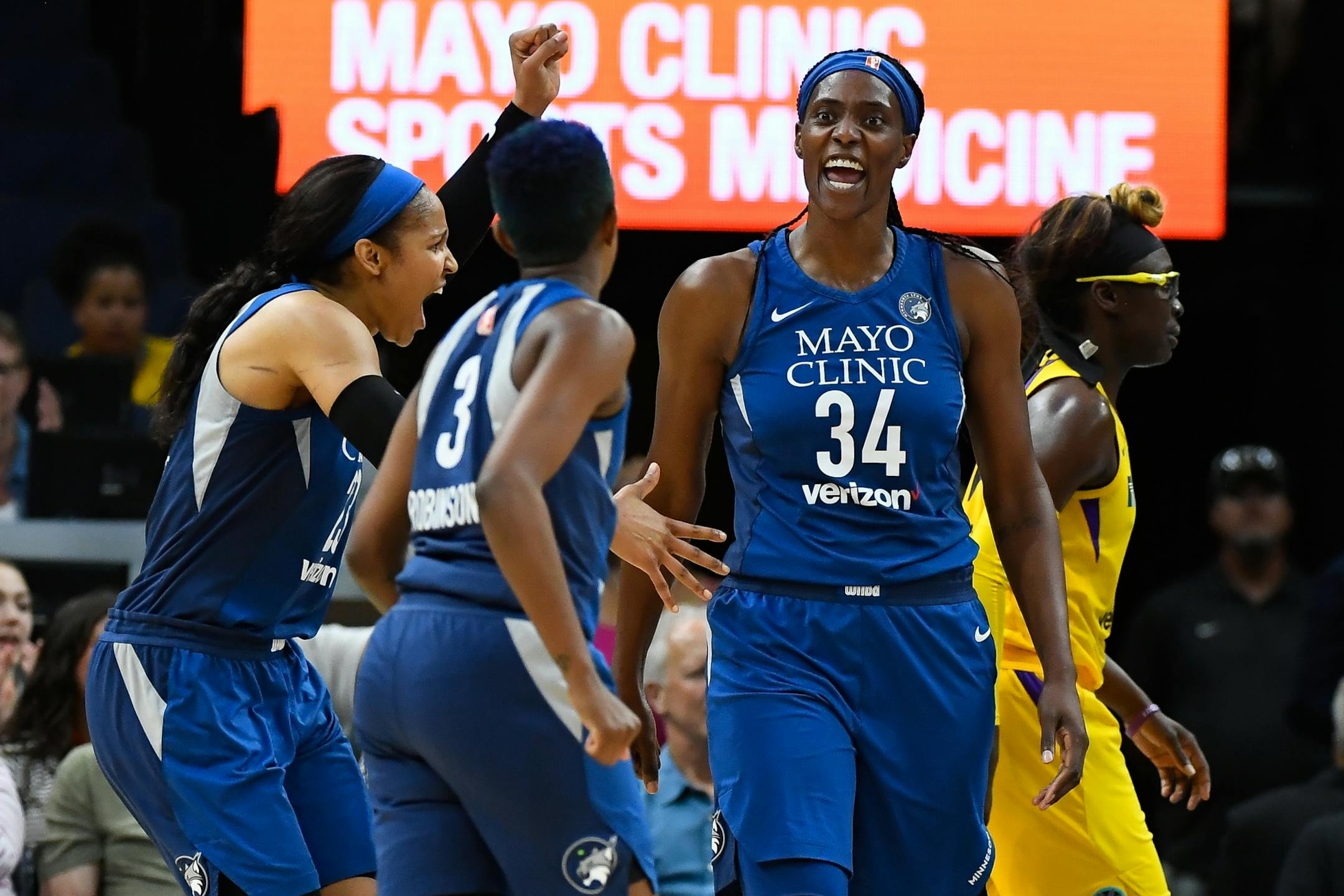 Minnesota Lynx forward Maya Moore (23), guard Danielle Robinson (3) and center Sylvia Fowles (34) celebrated a basket with an and-one opportunity scored by Fowles in the second quarter Thursday night.