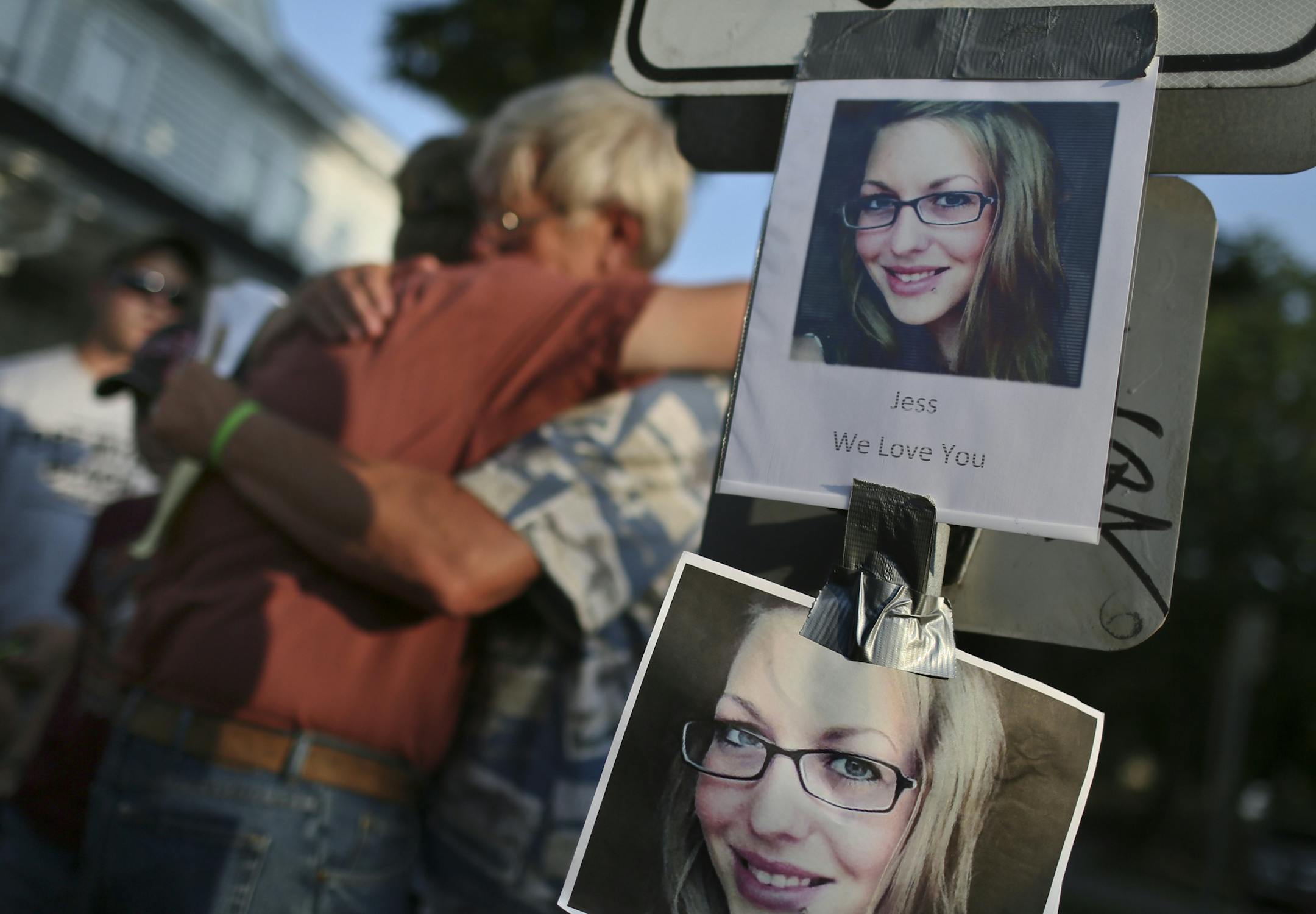 Jerome Hanson, Jessica Hanson's dad, left, and Tom Kummrow, Jessica's uncle, hugged at the corner of Pleasant Ave. and 28th St. in south Minneapolis during a vigil Friday, July 5, 2013. Bicyclist Jessica Hanson was killed by a hit-and-run driver.