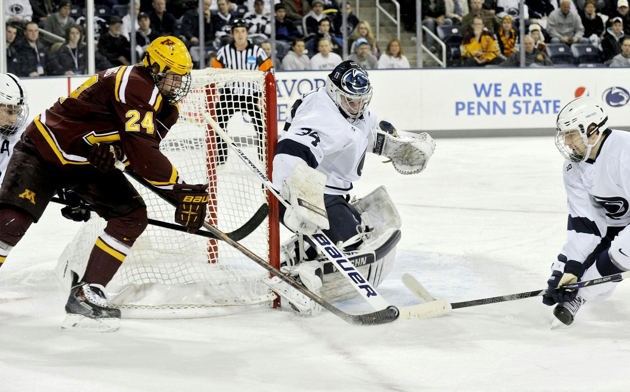 Penn State goalie Eamon McAdam knocked the puck away from the Gophers' Hudson Fasching. McAdam made 42 saves to keep the Nittany Lions close in Minnesota's 3-2 victory Sunday.