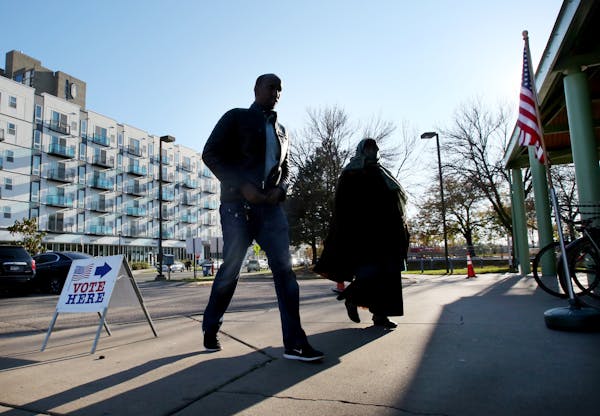 Voters head to the Brian Coyle Center in Minneapolis to cast their vote Tuesday, Nov. 7, 2017. A Republican proposal at the Legislature would prevent 