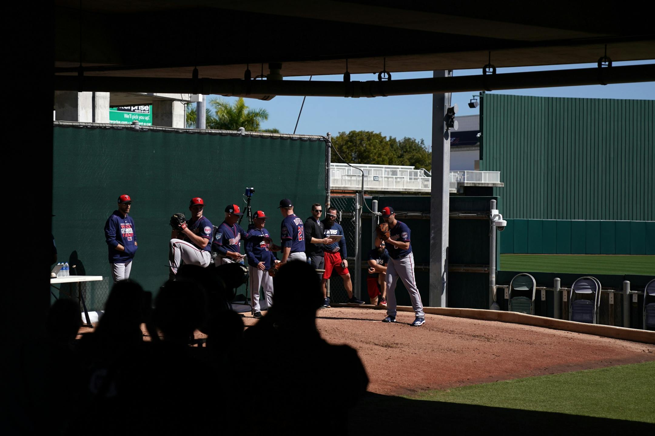 Fans watched from the shade as pitchers worked out in the bullpen a Hammond Stadium Thursday morning.