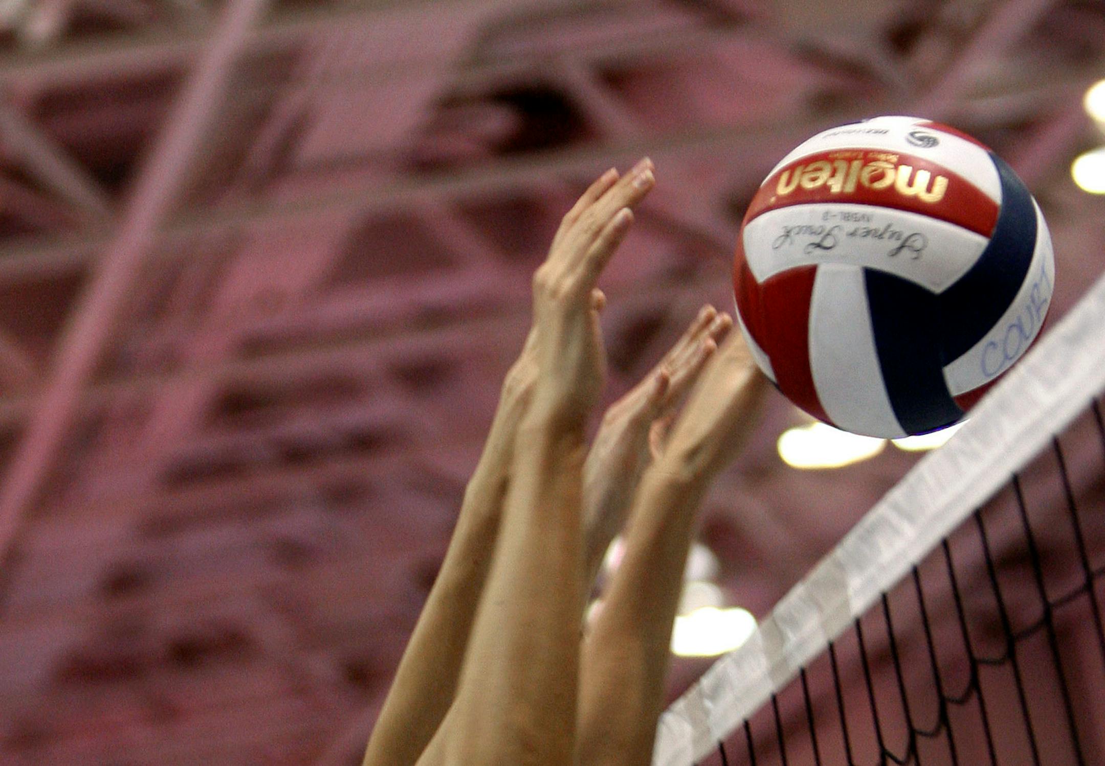 BRUCE BISPING ï bbisping@startribune.com Bruce Bisping/Star Tribune. Minneapolis, MN., Friday, 4/28/2006. CORRECTED CAPTION (left to right) Crossfire Spirit 18's Volleyball players Emily Palkert and Jessica Snell returned a volley against the Flatirons team from Boulder Colorado during the Northern Light National Qualifer for USA Volleyball at the Minneapolis Convention Center. The Crossfire team is a faith-based program whose mission is to glorify God through athletics.
