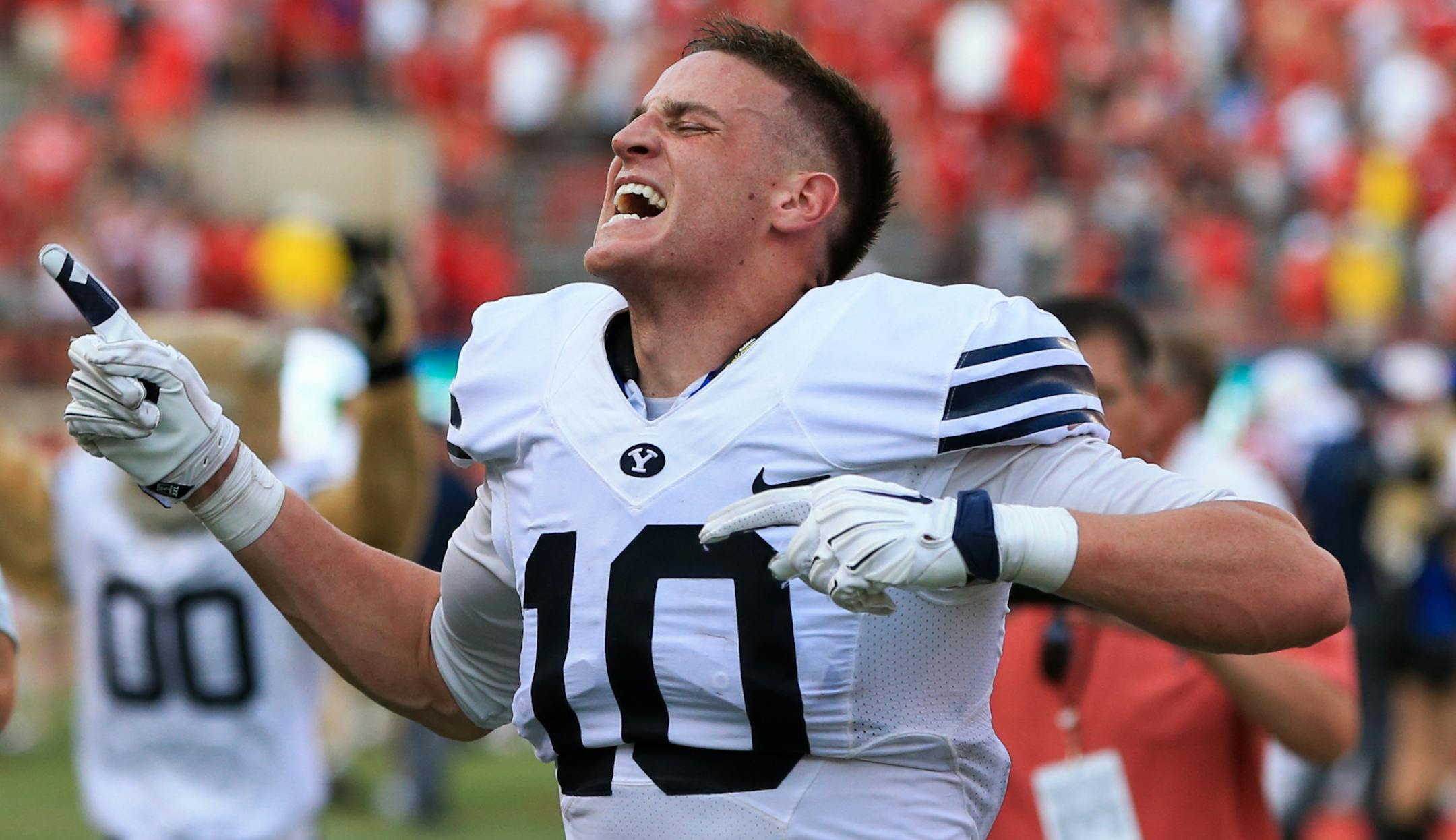 BYU wide receiver Mitch Mathews (10) reacts after catching the game-winning touchdown against Nebraska following the second half of an NCAA college football game in Lincoln, Neb., Saturday, Sept. 5, 2015. BYU won 33-28. (AP Photo/Nati Harnik)