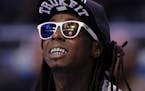 Rapper Lil Wayne enjoyed the NBA All-Star basketball game in 2012.