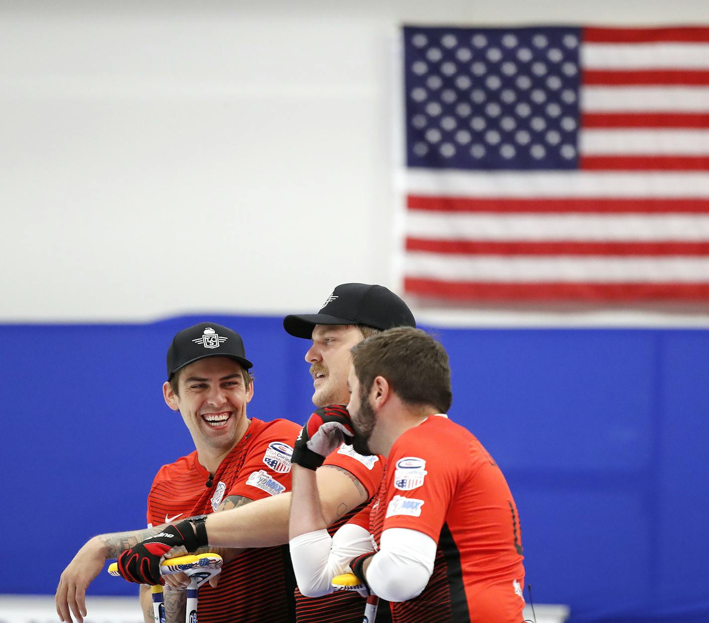 From left, Team USA teammates and new celebrities Chris Plys, Matt Hamilton and John Landsteiner talked between ends during a competition against Japan last week at the Chaska Curling Center.