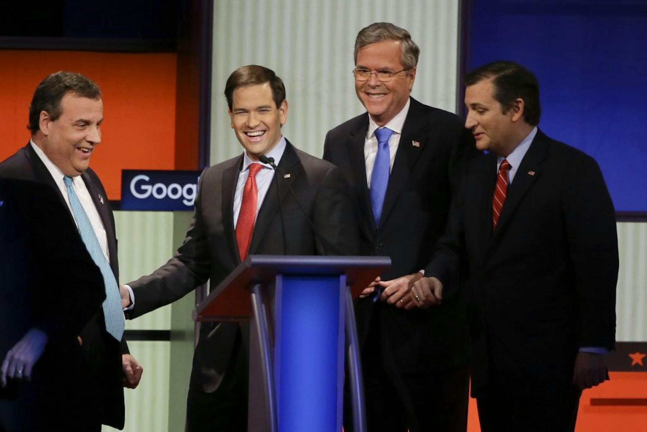 Republican presidential candidates New Jersey Gov. Chris Christie, Sen. Marco Rubio, R-Fla., former Florida Gov. Jeb Bush and Sen. Ted Cruz, R-Texas, talk after the Republican presidential primary debate Thursday in Des Moines.