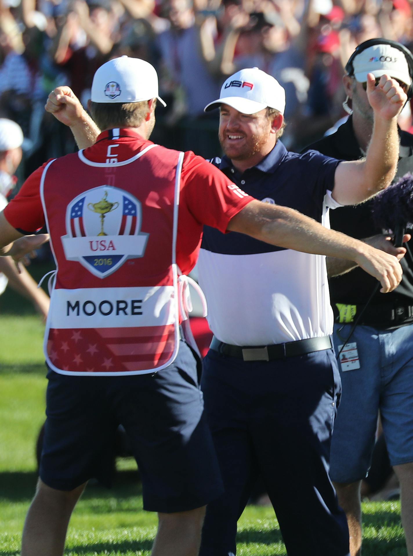 USA&#xed;s Ryan Moore celebrated with his caddie after clinching the the win for the US team on the 18th hole. ] (LEILA NAVIDI/STAR TRIBUNE)
leila.navidi@startribune.com The Ryder Cup was held on Sunday, October 2, 2016 at Hazeltine National Golf Club in Chaska, Minn.