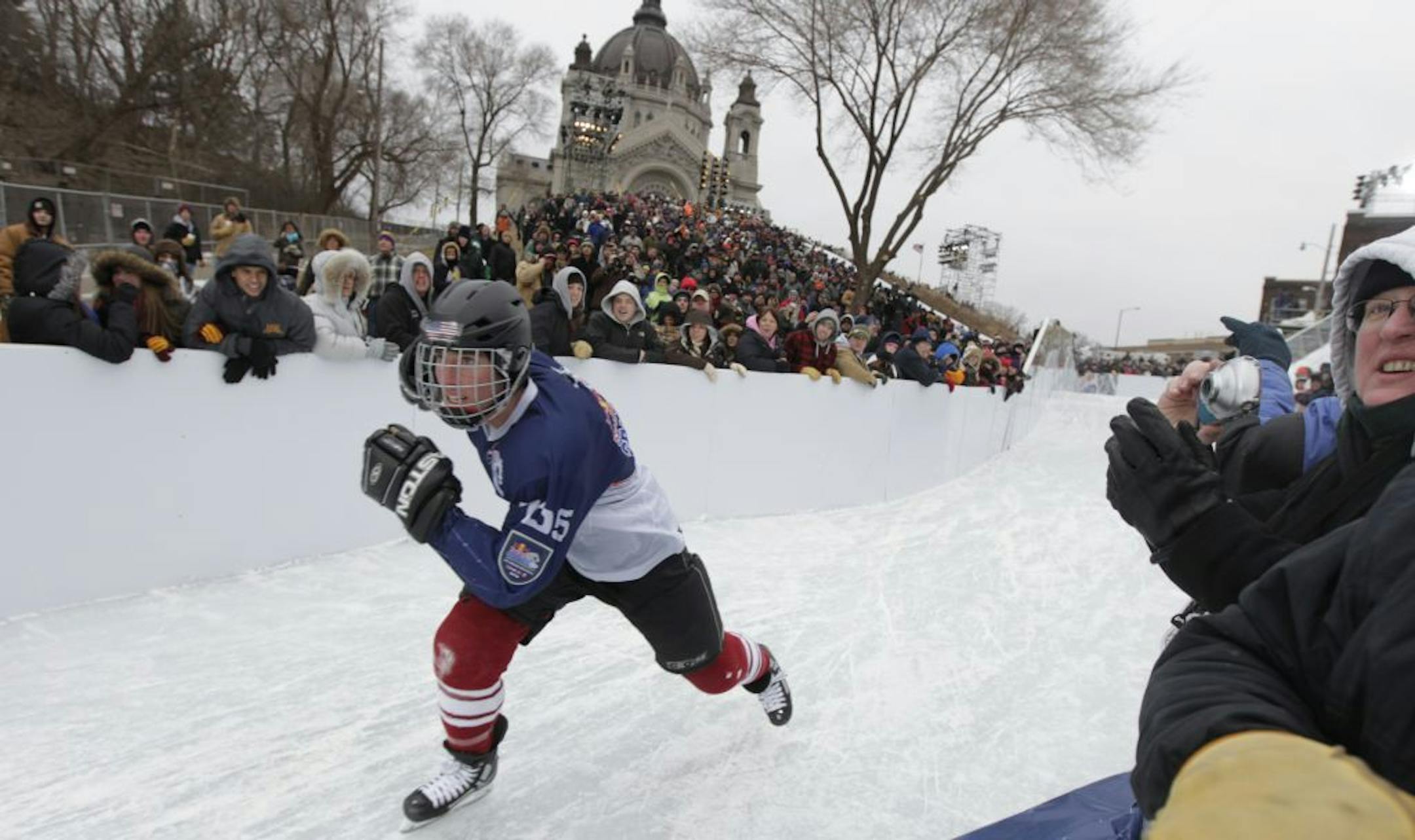 Tigh Isaac Red competed in USA Shootout event at the Red Bull Crashed Ice World Championship course Thursday St. Paul. Each athlete has two times runs. The best 64 athletes move on to the Friday night elimination round.