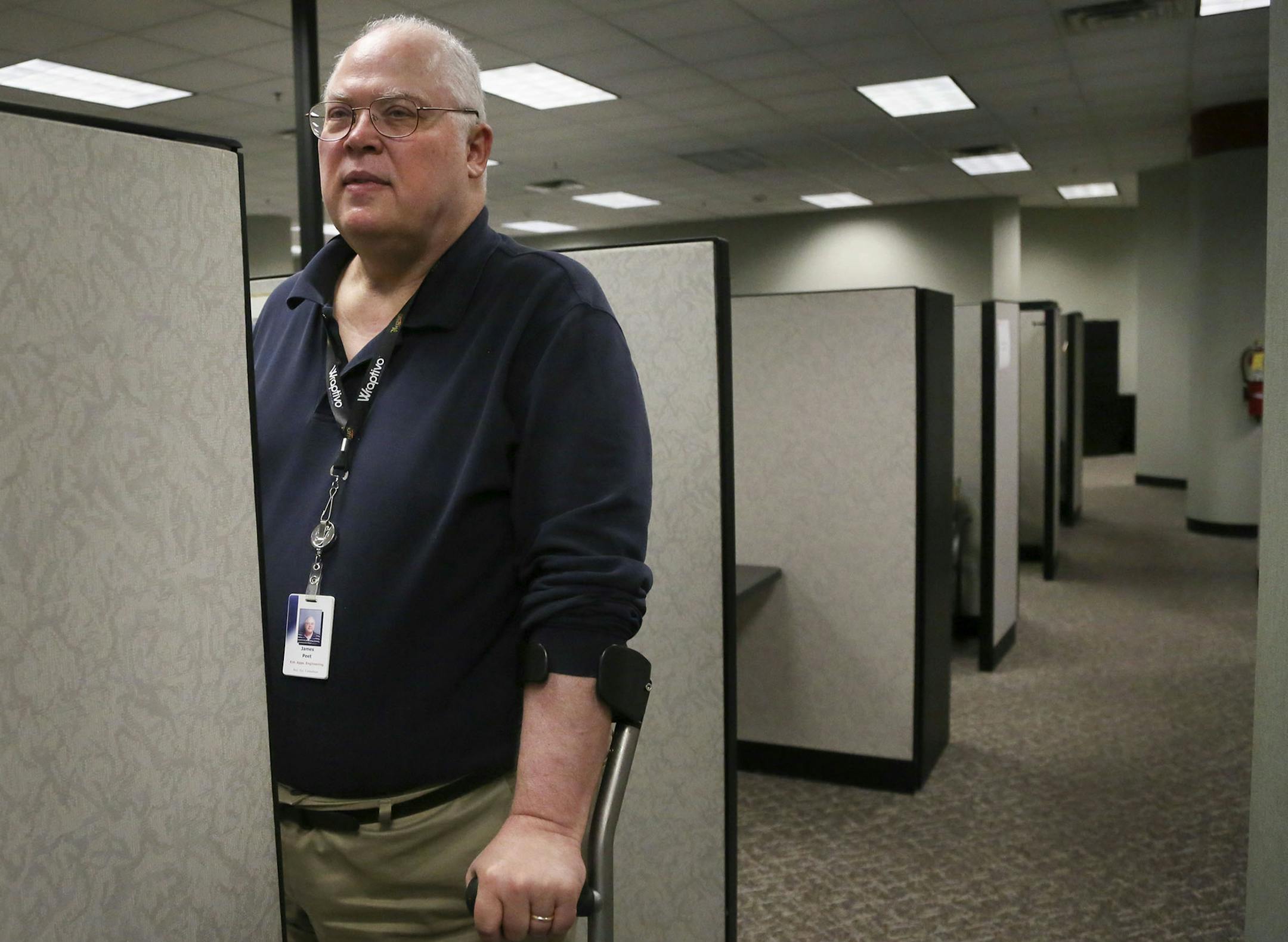 Wells Fargo business systems consultant Jim Peet,who was injured in a trampoline accident in 1987, in his work space at Wells Fargo operations center Thursday Aug. 28, 2014, in Minneapolis MN.] (DAVID JOLES/STARTRIBUNE)djoles@startribune Minnesota employs more people than before the Great Recession, but the the unemployment rate of the able-to-work developmently disabled remmains 25 percent-plus. Here are the issues and f ew solutions embodied in several can-do workers who bring insight and spec
