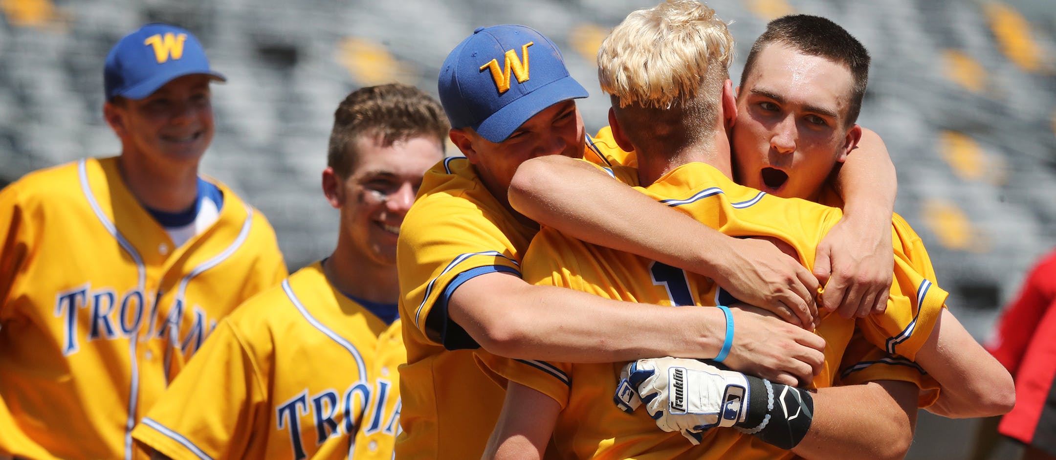 Wayzata celebrates the game winning home run by Griffin Schneider, center with back to camera. ] (Leila Navidi/Star Tribune) leila.navidi@startribune.com BACKGROUND INFORMATION: Lakeville North against Wayzata in the boys baseball state semifinals at CHS Field in St. Paul on Friday, June 17, 2016.