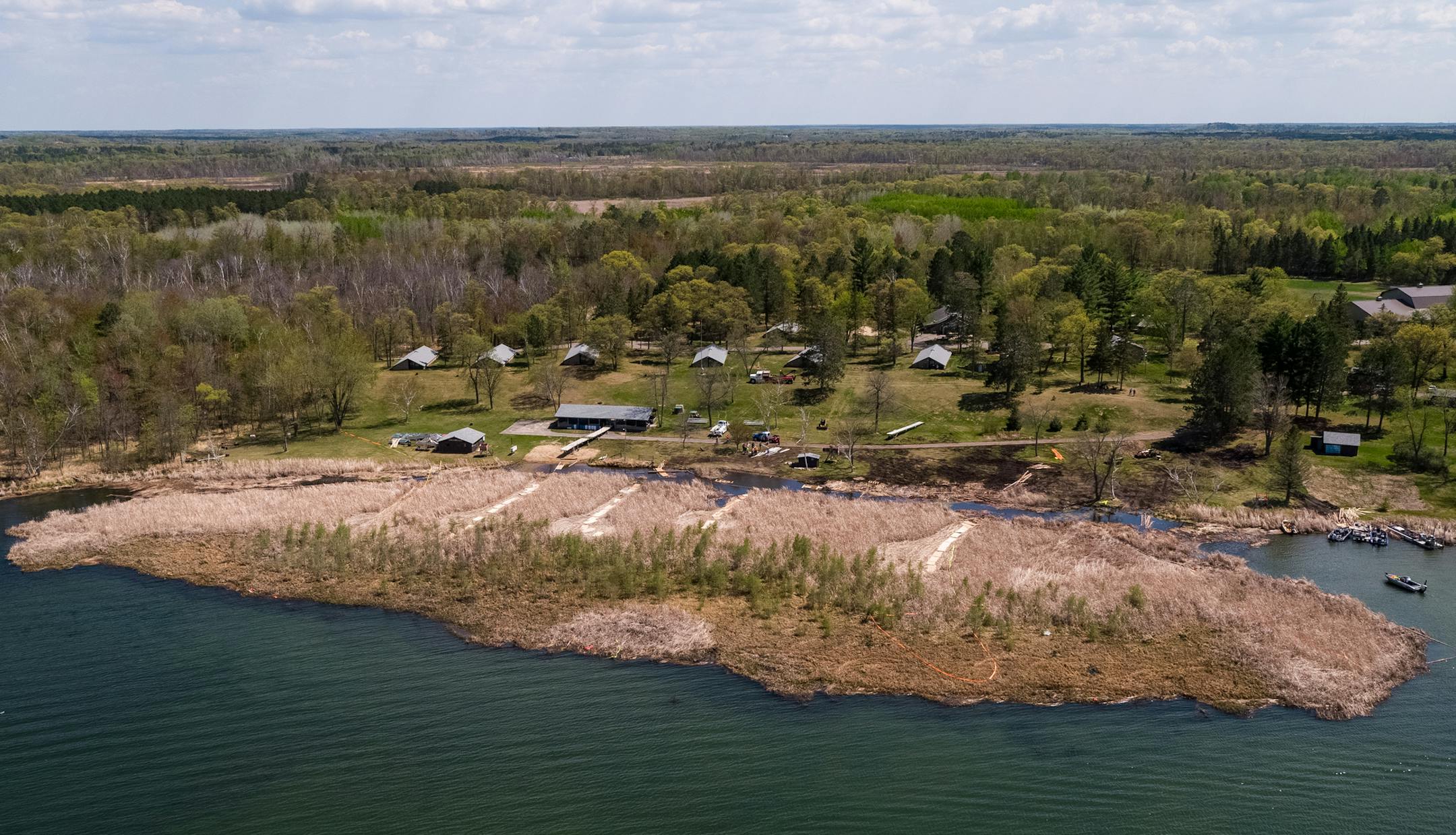Summer programs at Legionville have been canceled as workers hack away at the monster bog that grounded on the beach at the camp for Minnesota school safety guards. ORG XMIT: MIN1805241200121427