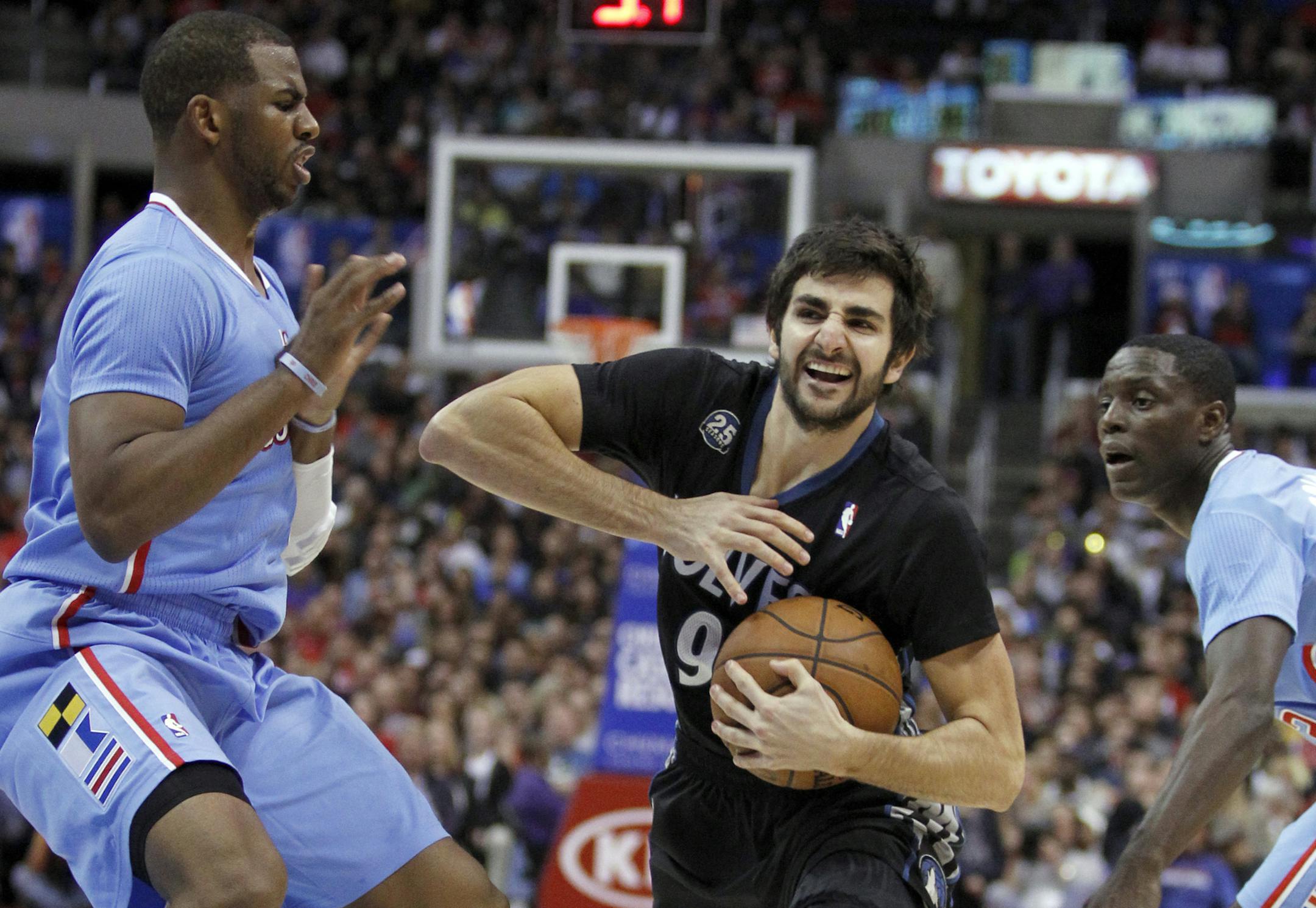 Wolves point guard Ricky Rubio, driving between Clippers guards Chris Paul (3) and Darren Collison, needs to be much better down the stretch in games. Rubio has a combined three points in the fourth quarter and overtimes of nine close-game losses.