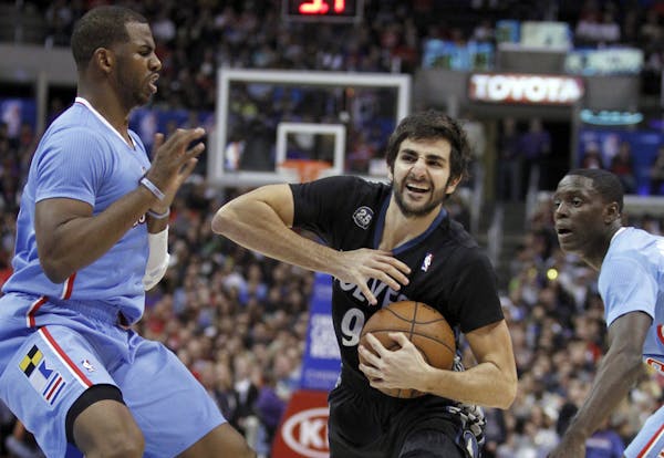 Wolves point guard Ricky Rubio, driving between Clippers guards Chris Paul (3) and Darren Collison, needs to be much better down the stretch in games.