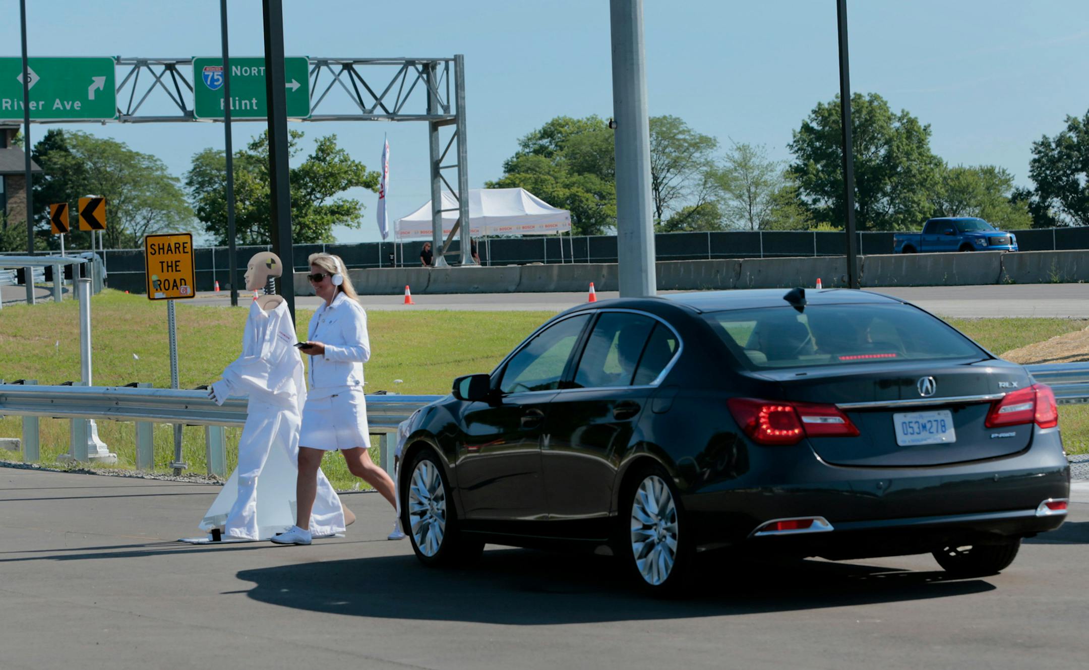 A 2015 Acura automated vehicle stops for a pedestrian during a test at the University on Michigan's North Campus Research Complex in Ann Arbor, Michigan, on July 20, 2015. MUST CREDIT: Bloomberg photo by Jeff Kowalsky.