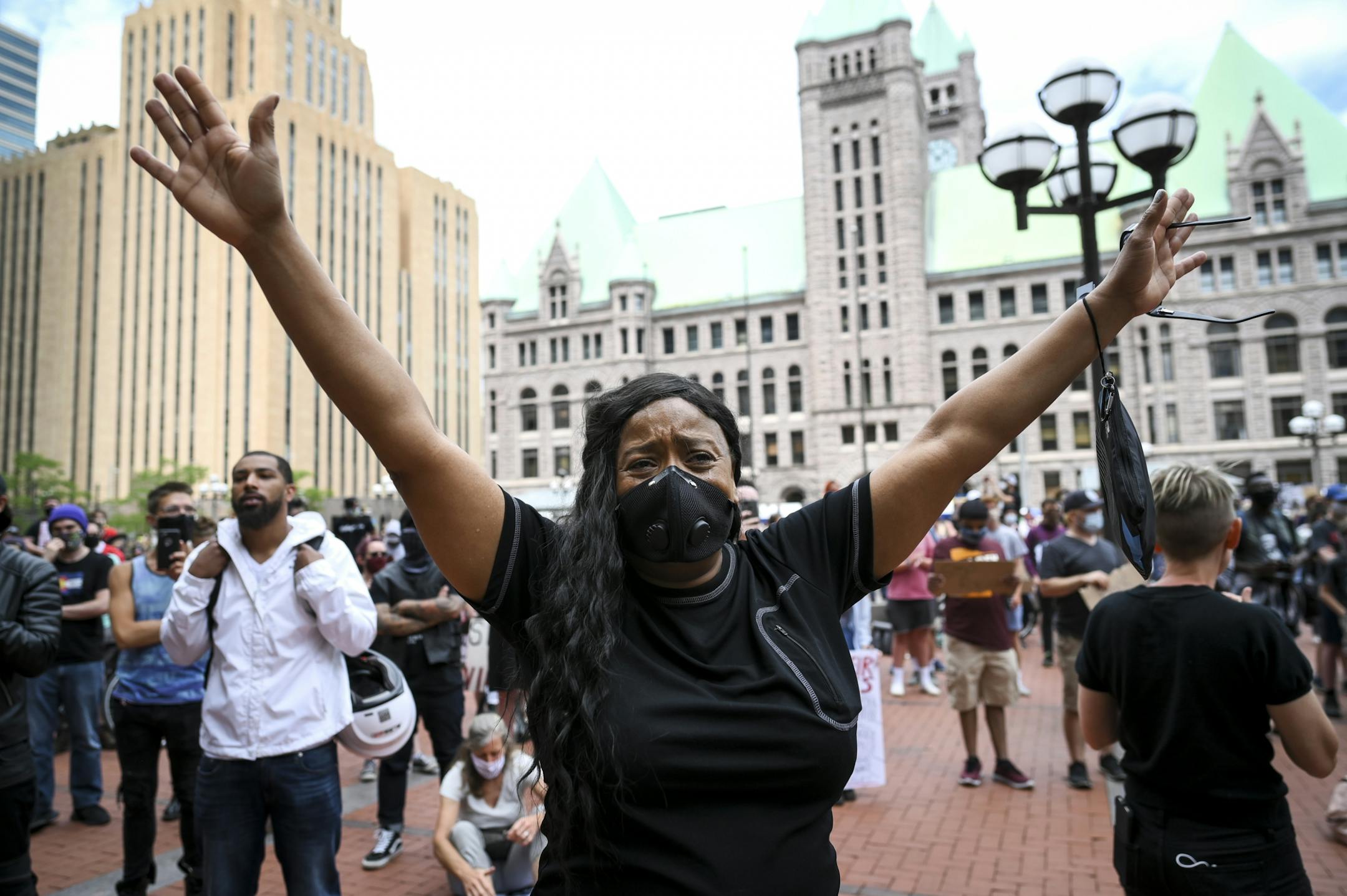 Tears streamed down the face of Felicia Johnson, of St. Paul as she was overcome with grief during the reading of names of people killed by police Saturday outside the Hennepin County Government Center. "I am tired of being sick and tired," said Johnson. "I'm here to stand for truth. I'm here to stand for justice. I'm here to stand for Righteousness."