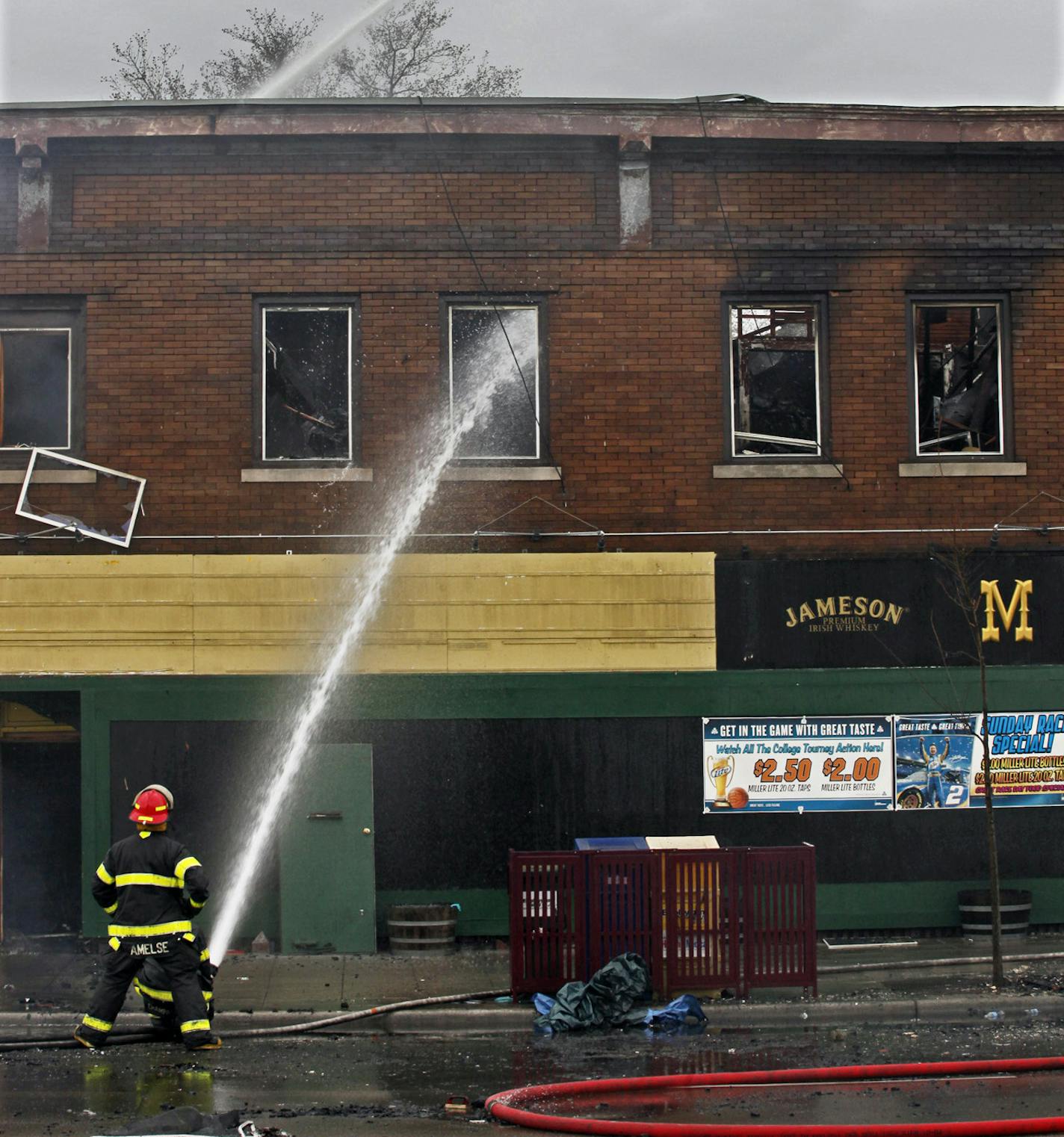 MARLIN LEVISON * mlevison@startribune.com April 2, 2010 - GENERAL INFORMATION: Structural fire at 30th and Lake Street in Minneapolis with fatalities. IN THIS PHOTO: ] Firemen poured water on the structure at 3001 East Lake Street.