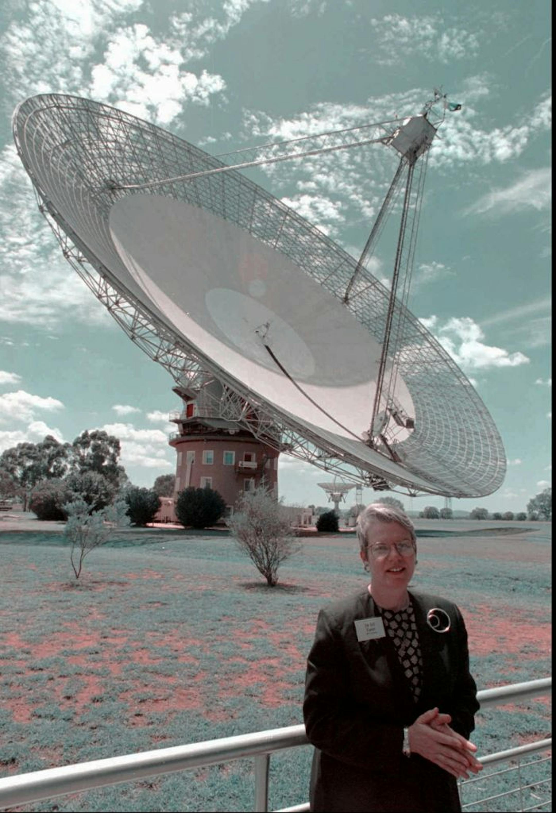 Project Phoenix scientist Jill Tarter stands in front of the Parkes radio telescope, 220 miles (350 km) west of Sydney, as the search for extra terrestrial life begins, Thursday, Feb. 2, 1995. Scientists from the California-based Search for Extraterrestrial Intelligence (SETI) will use the huge white dish to listen in on billions of radio waves across the galaxy in their search.