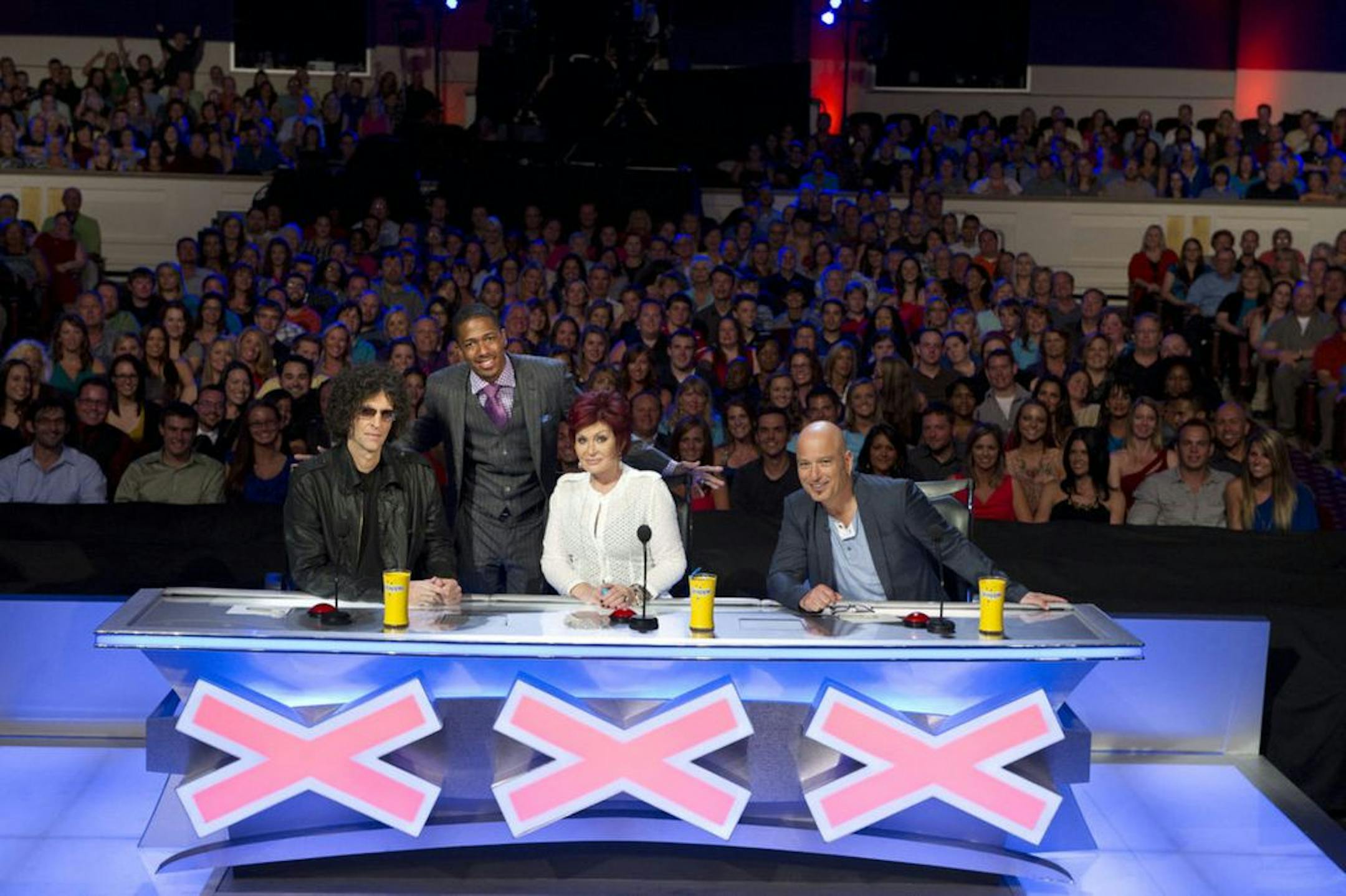 "America's Got Talent" host Nick Cannon, second from left, with judges Howard Stern, left, Sharon Osbourne and Howie Mandel.