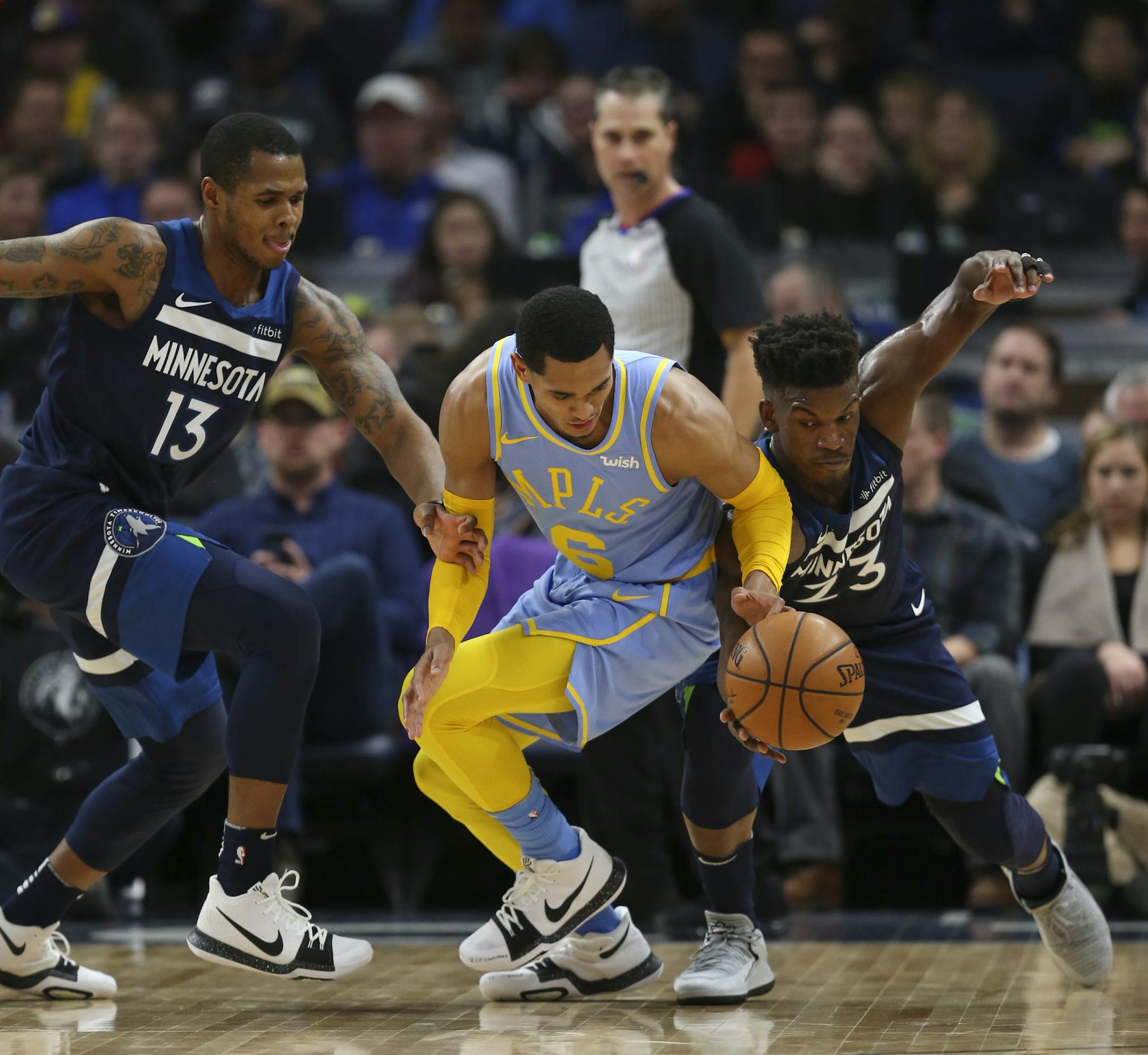 Minnesota Timberwolves guard Jimmy Butler (23) stole the ball from Los Angeles Lakers guard Jordan Clarkson (6) in the second quarter Monday night. At left was Minnesota guard Marcus Georges-Hunt (13). ] JEFF WHEELER ï jeff.wheeler@startribune.com The Minnesota Timberwolves faced the Los Angles Lakers in a New Year's Day NBA game Monday night, January 1, 2018 at Target Center in Minneapolis.
